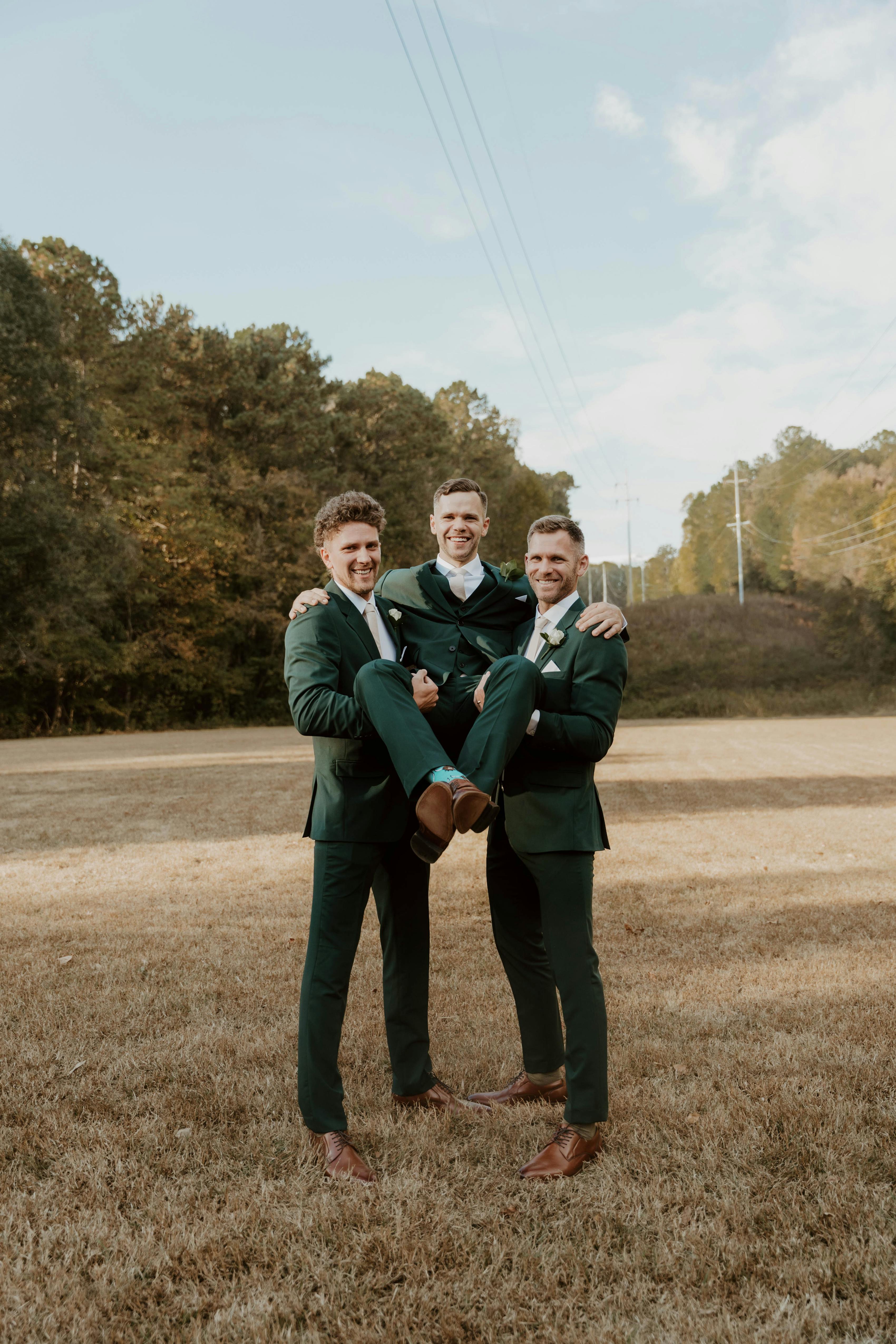 Green groomsman suits with recycled fabric