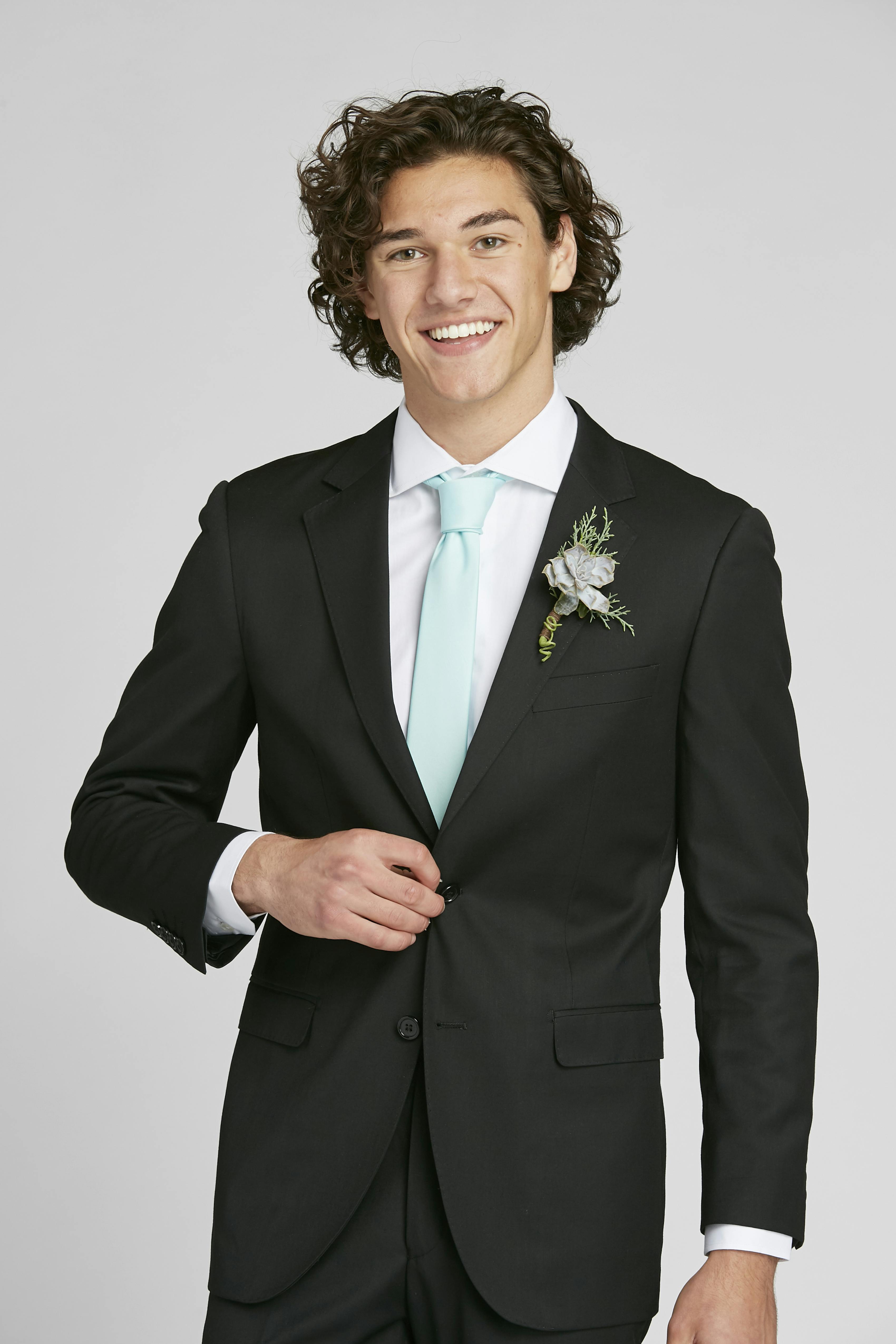 Classic black prom suit with light blue tie and boutonniere