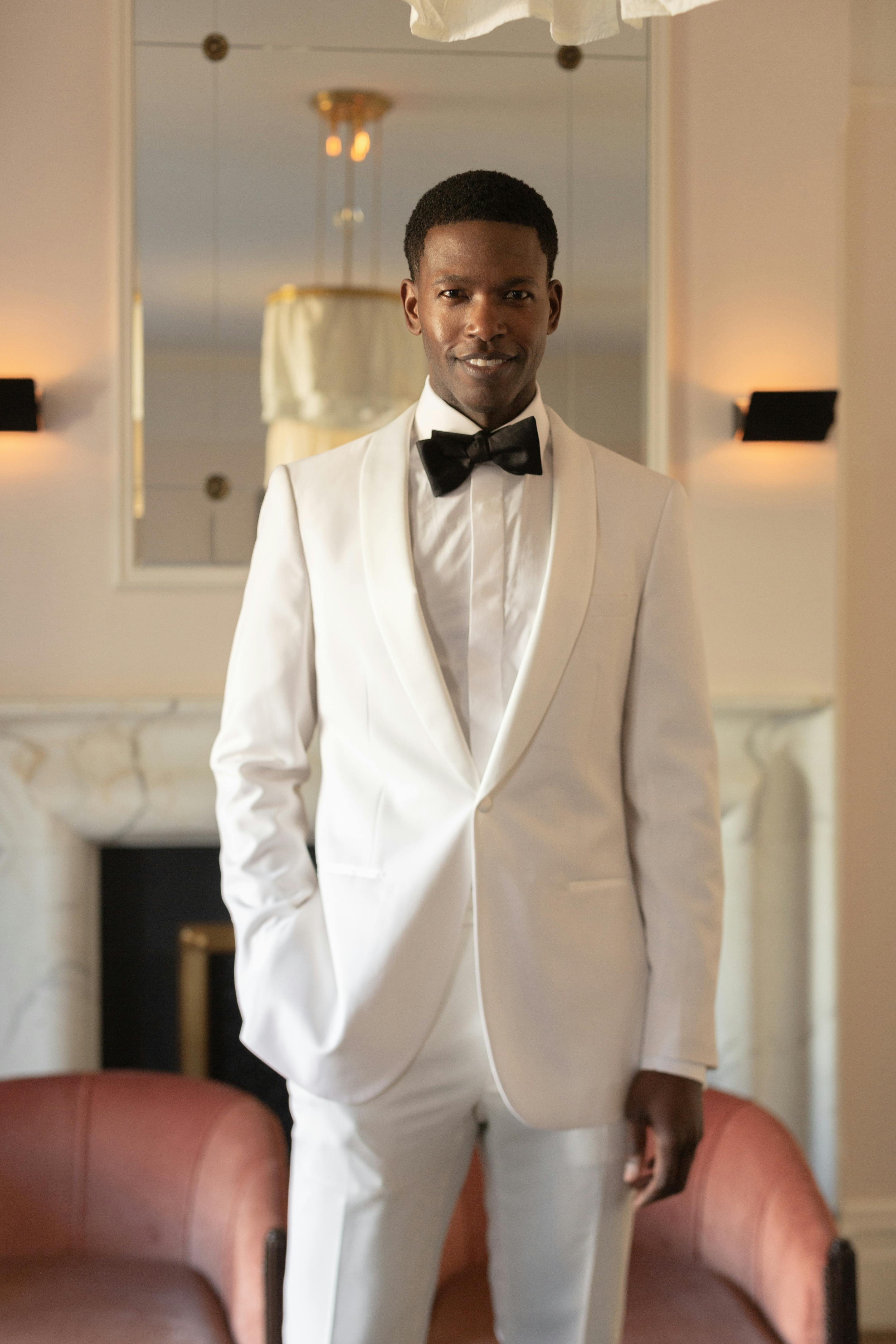 White tuxedo for prom with black bow tie