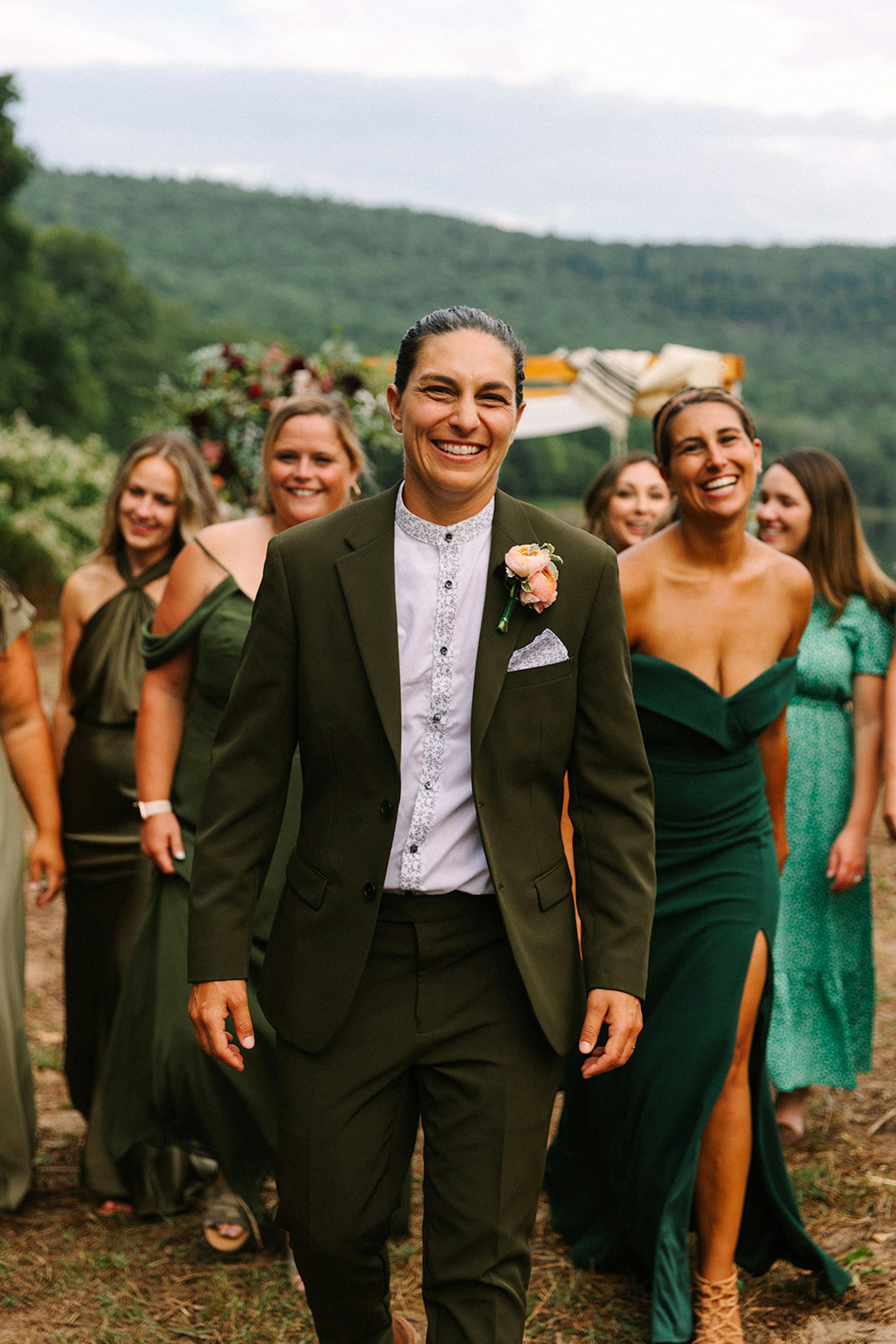 Green theme wedding party with bride wearing women's olive green