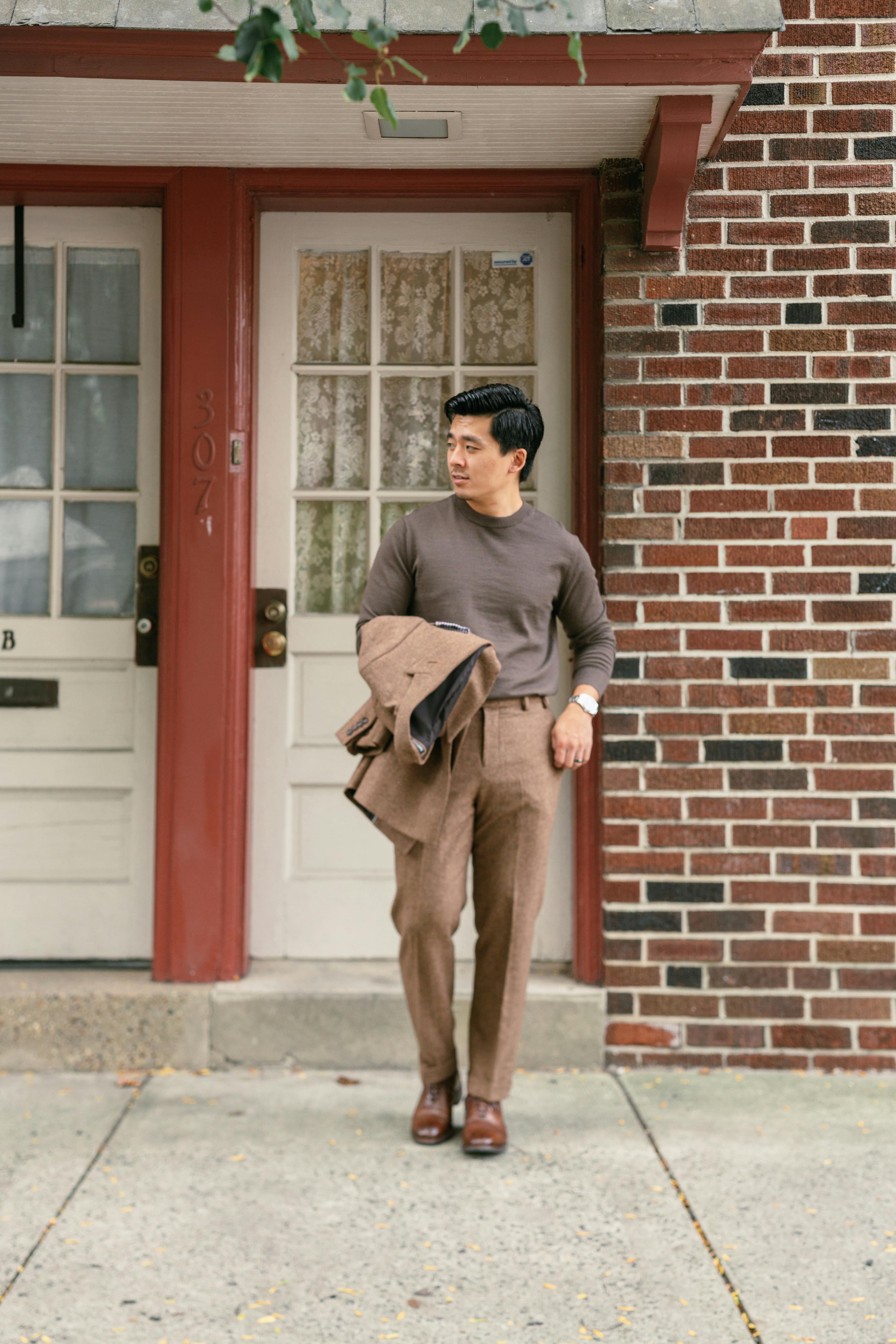 Men's smart casual office outfit with brown tweed suit and beige sweater