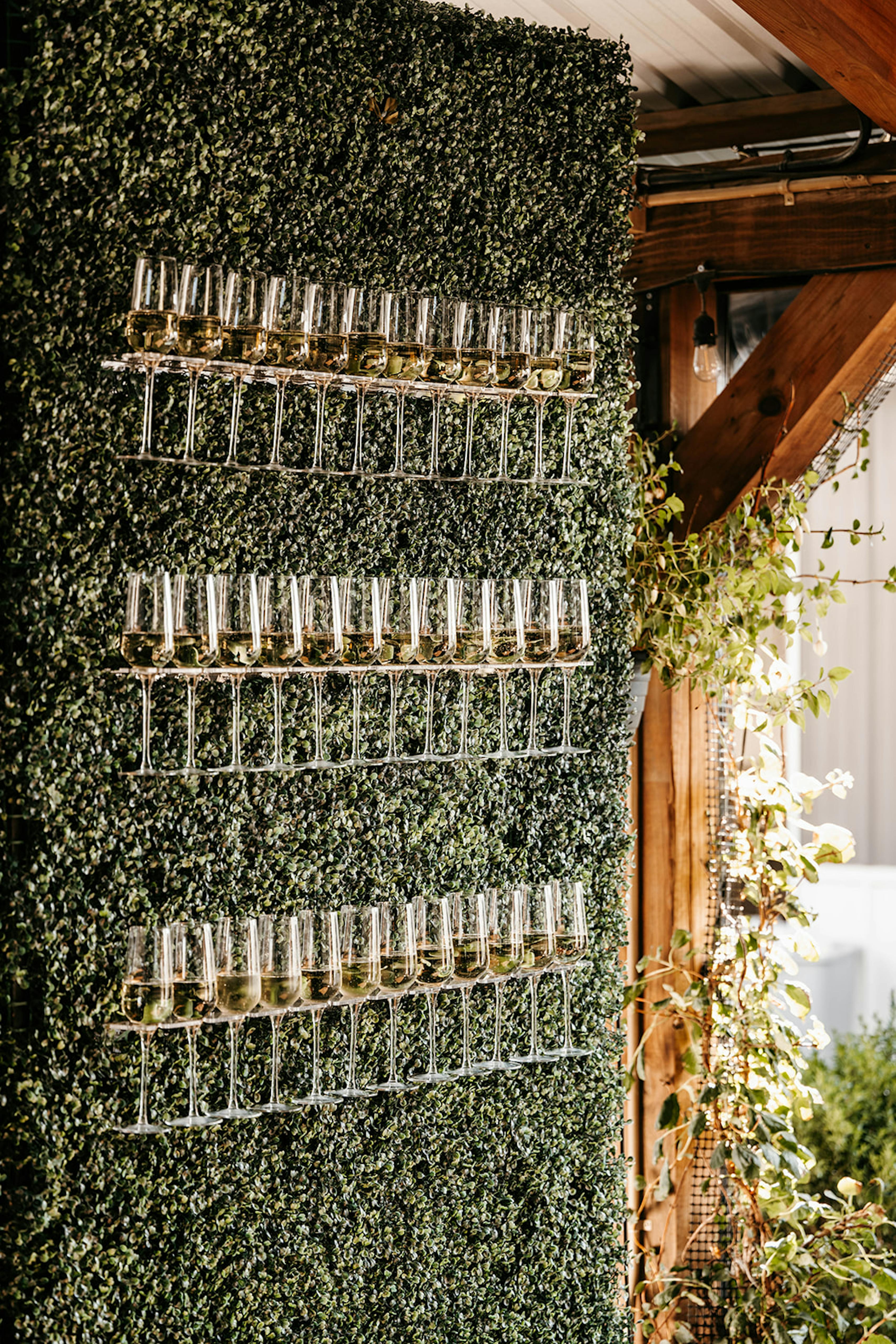 wedding cocktail hour decor champagne flute wall