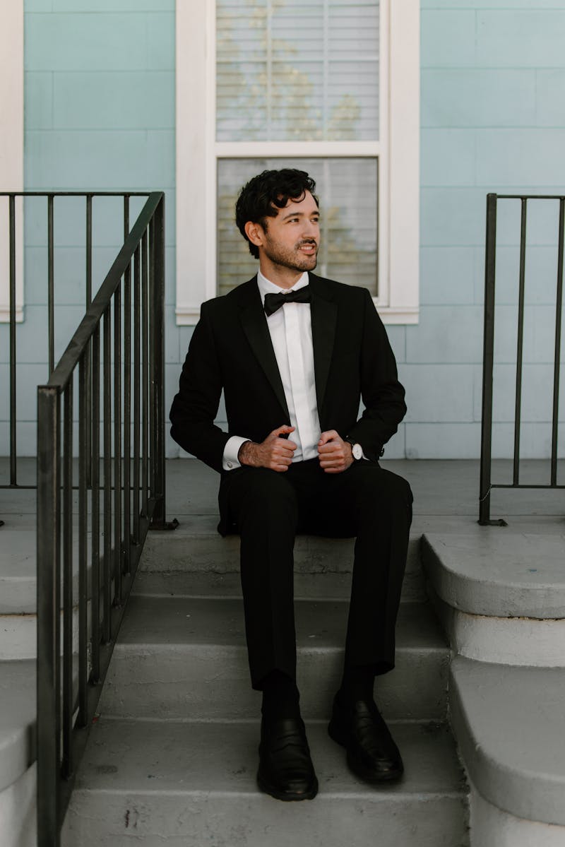 groom's tuxedo look with white dress shirt and black bow tie