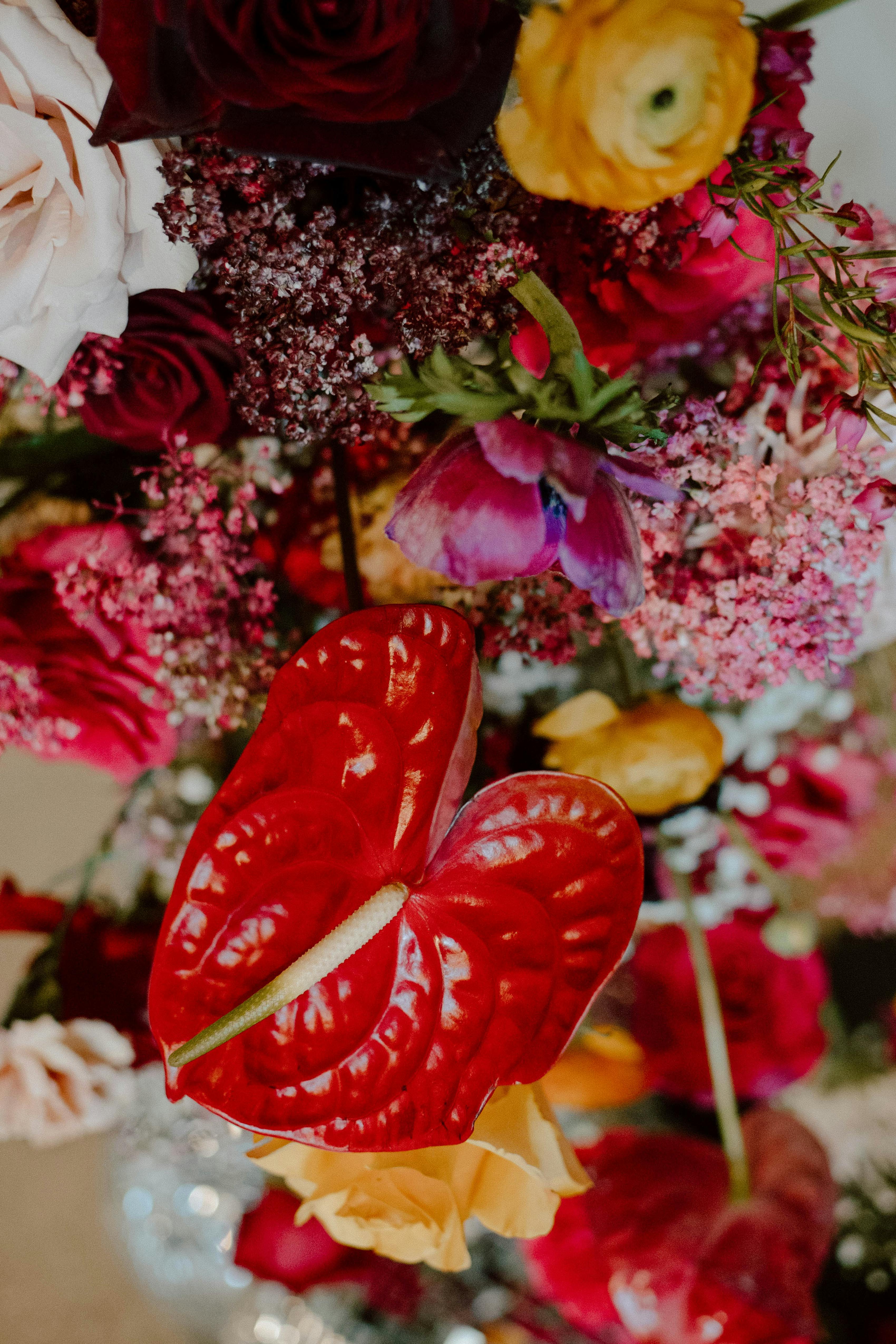 Eclectic florals in bright creative wedding bouquet for cherry red wedding