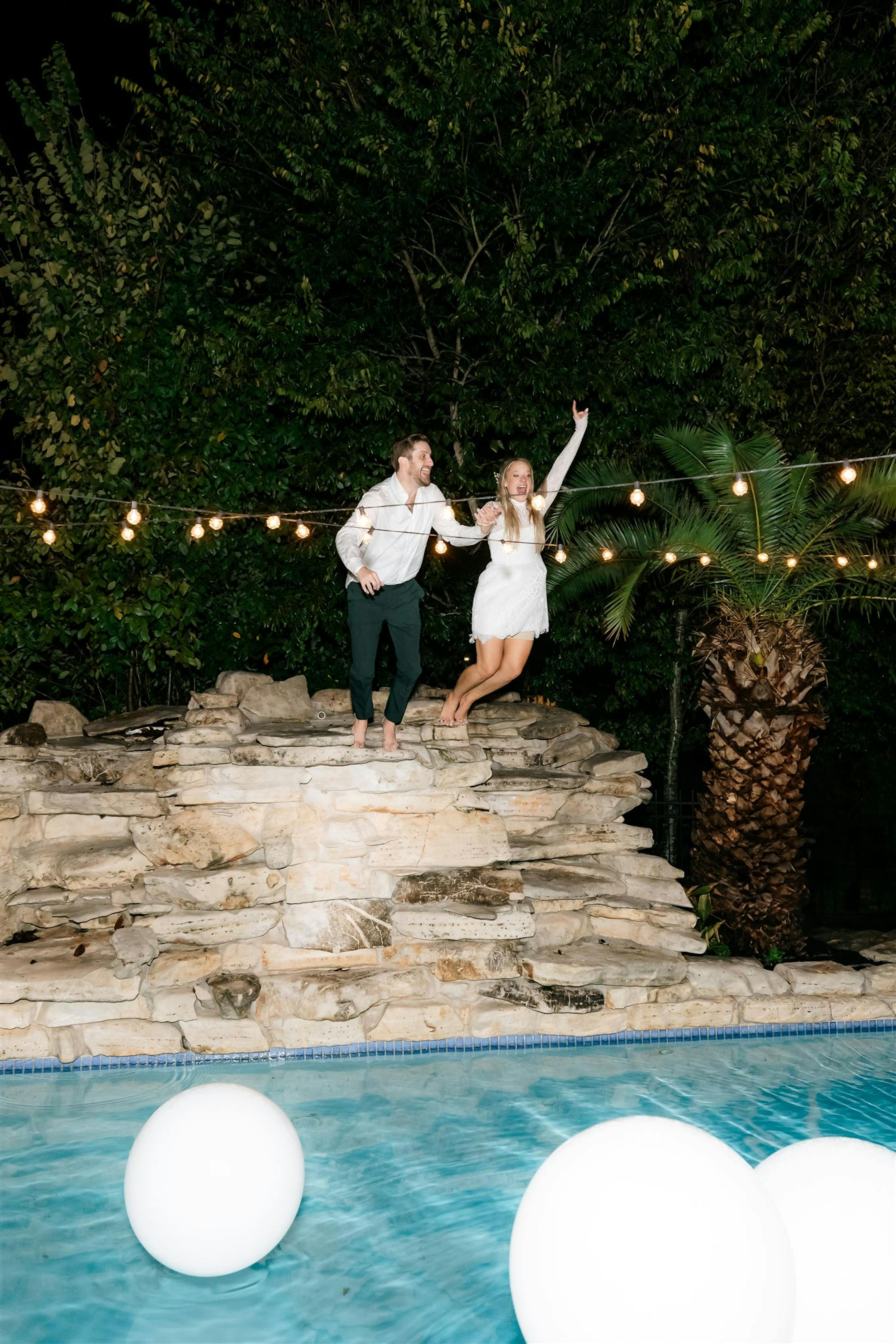 jumping into a pool after the wedding reception