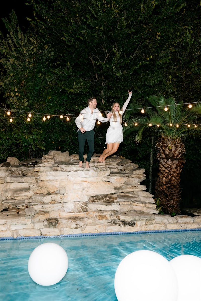 jumping into a pool after the wedding reception