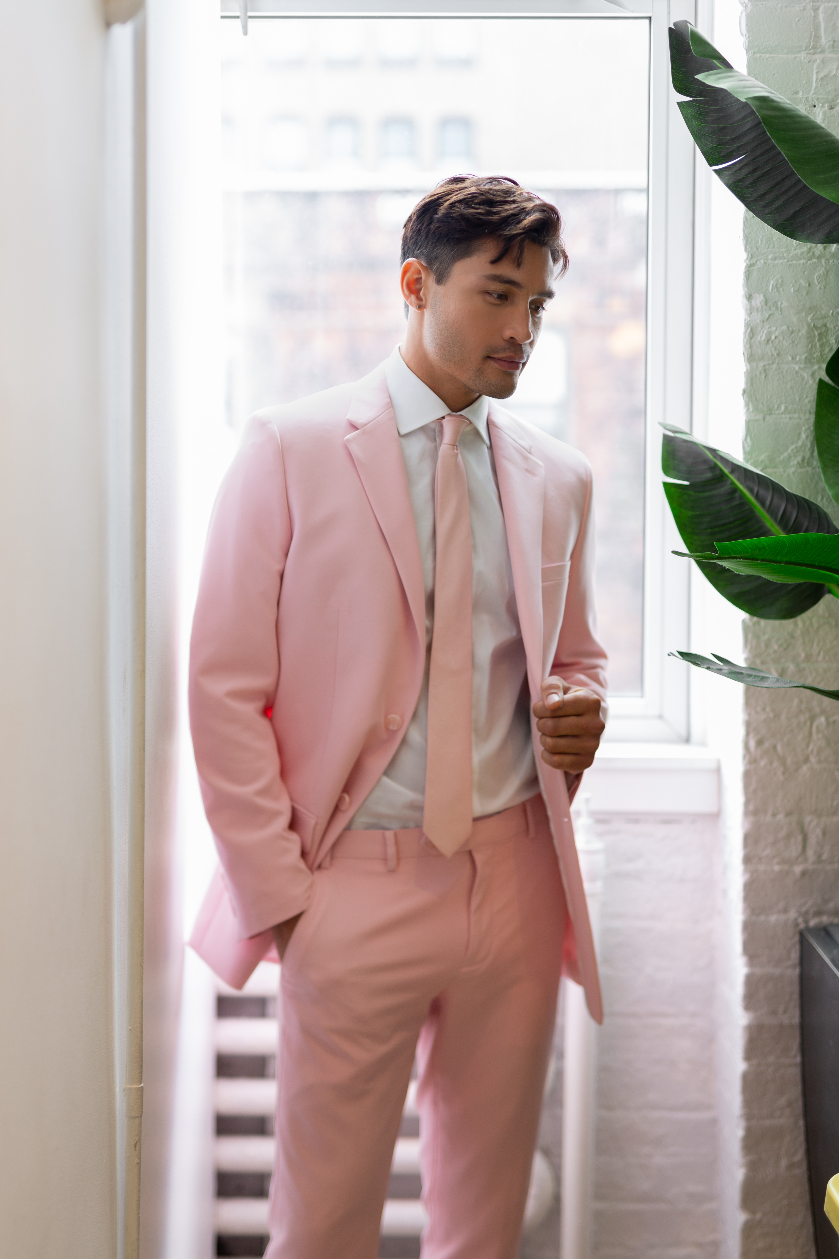Guy's pastel prom outfit with light blush pink suit and matching tie
