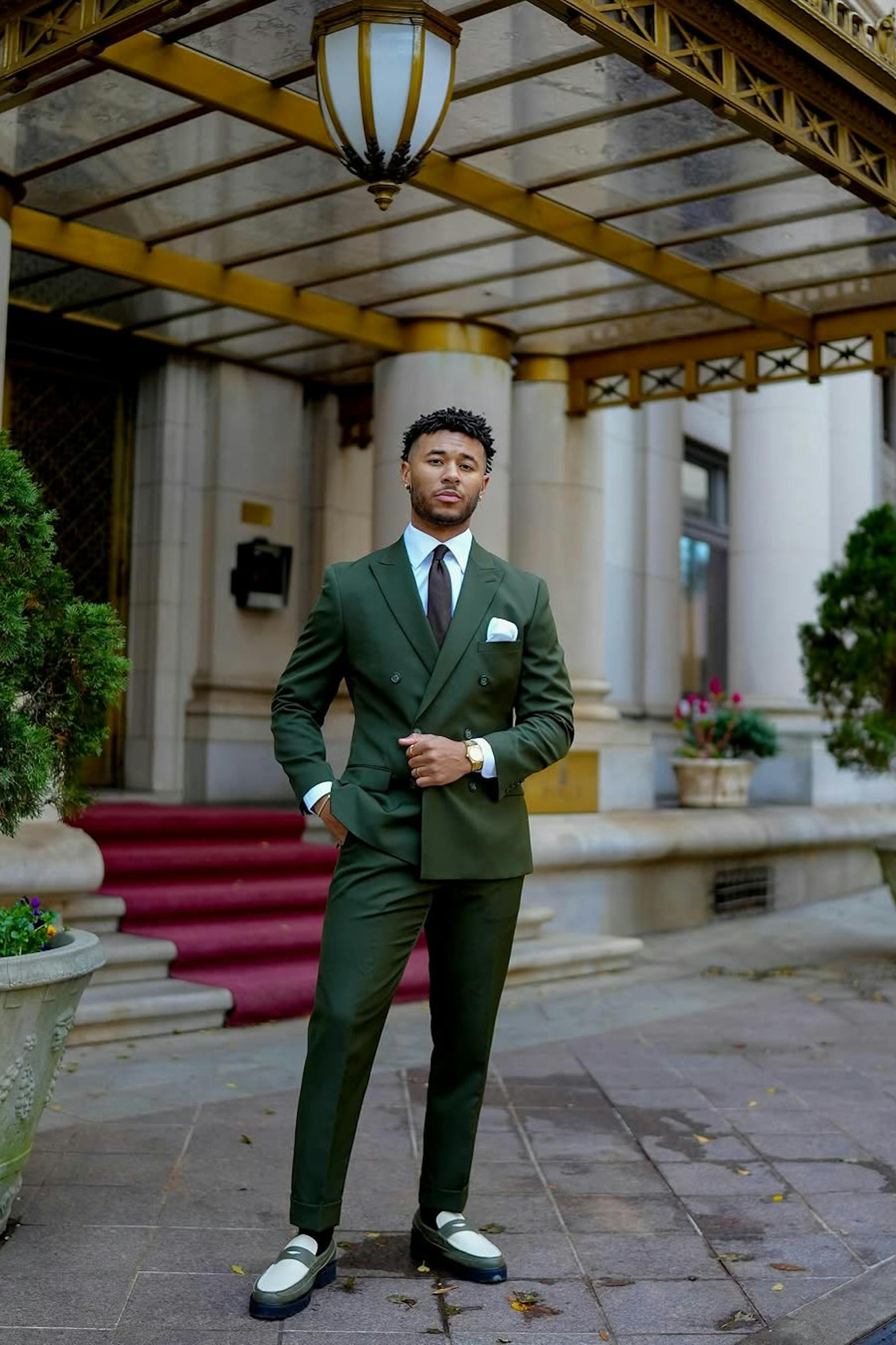Double breasted dark green suit and loafers for semi-formal men's wedding guest outfit