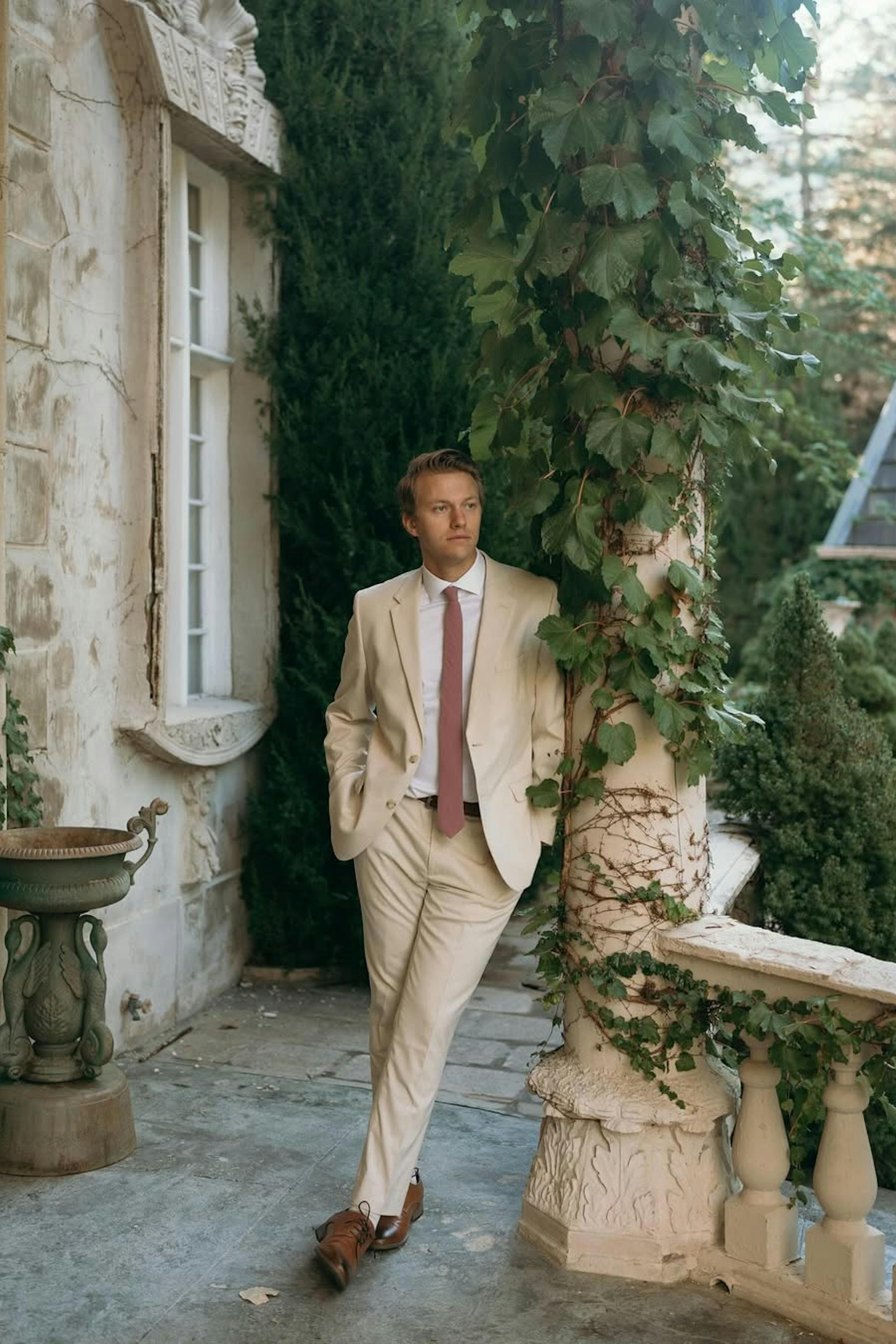 Men's light tan suit to wear to a cocktail wedding with brown dress shoes
