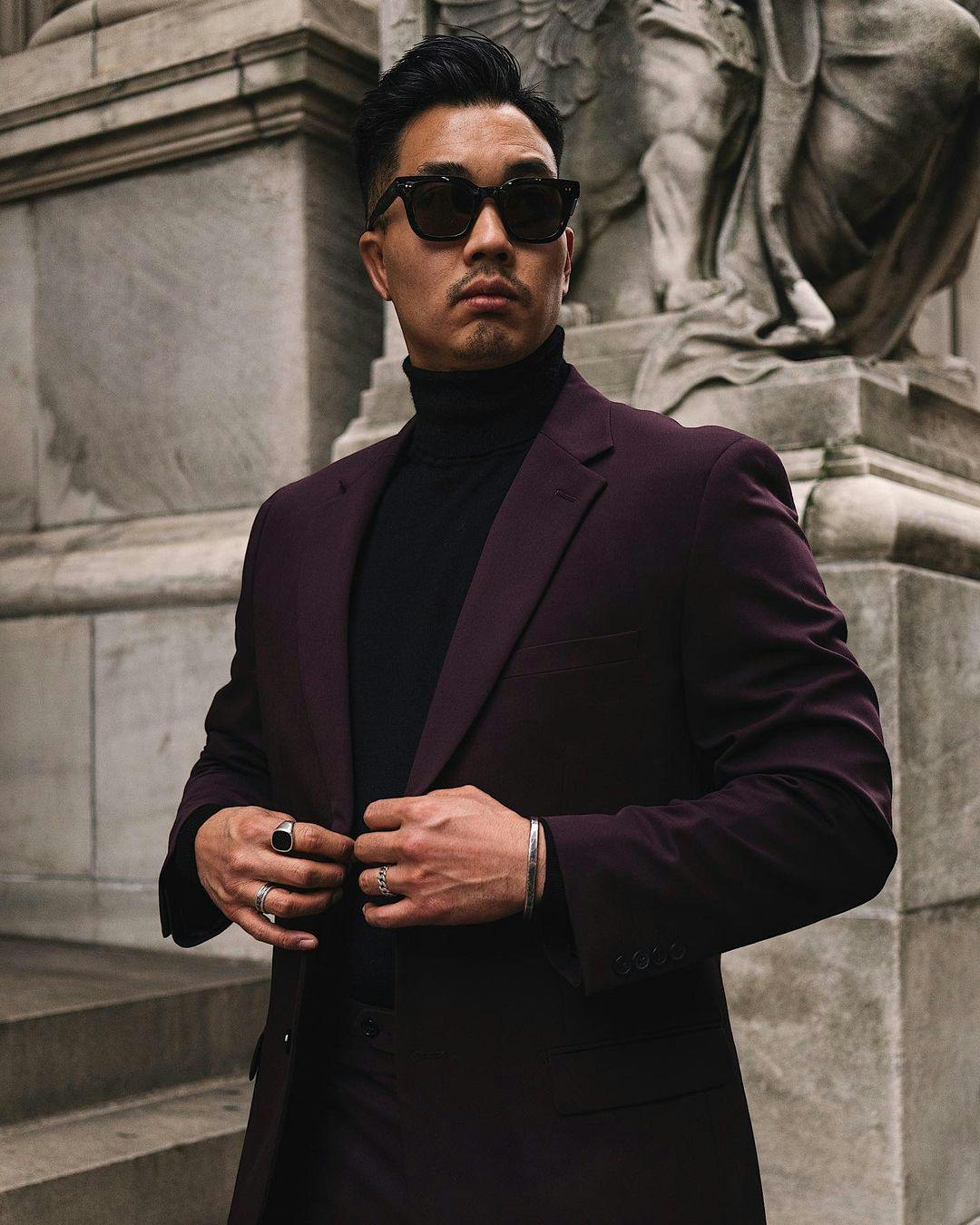 Maroon men's suit styled with black turtleneck