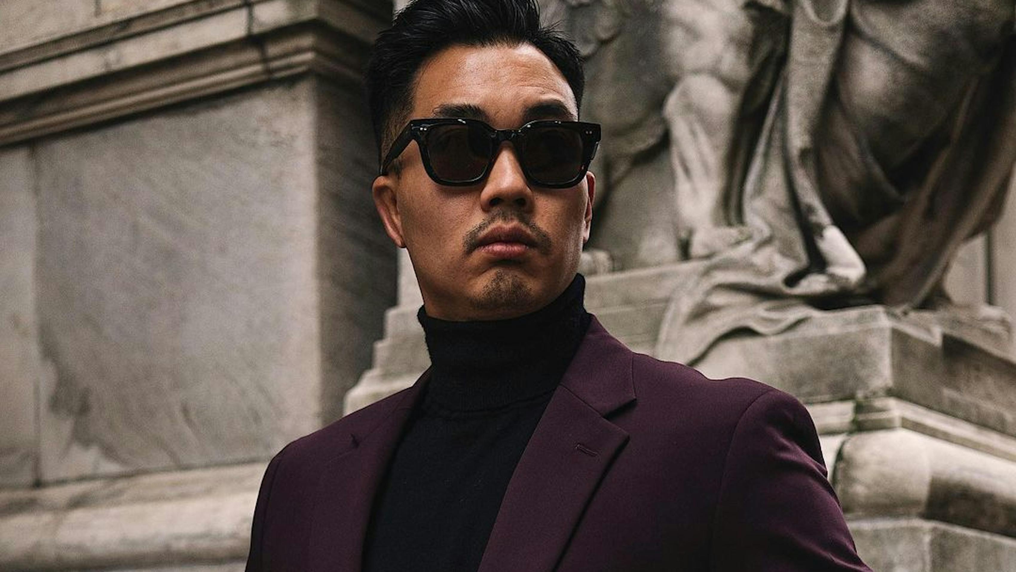 Fashionable menswear for winter in burgundy suit blazer and black turtleneck outfit