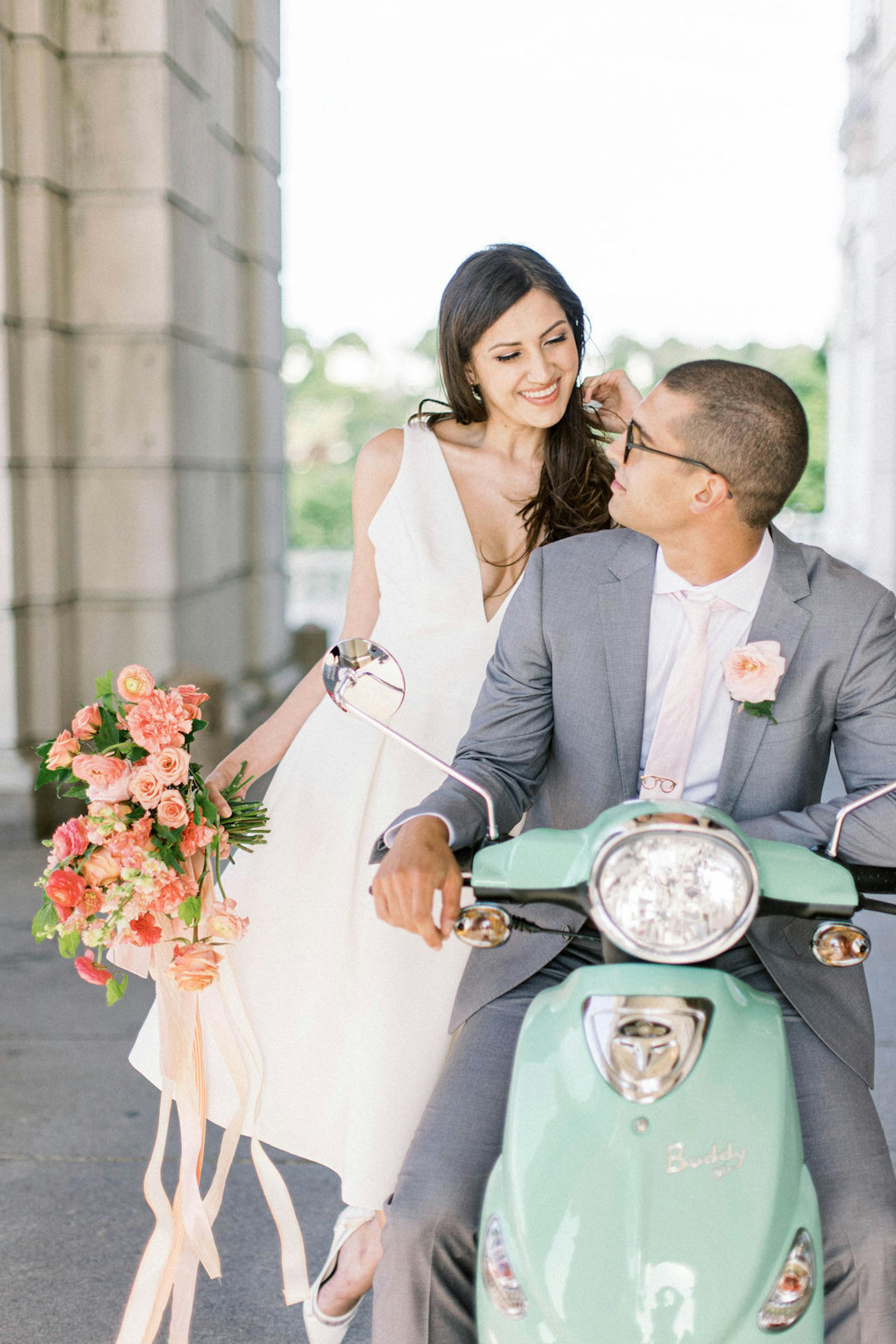 Bride and groom on mint green vespa for pastel spring destination wedding