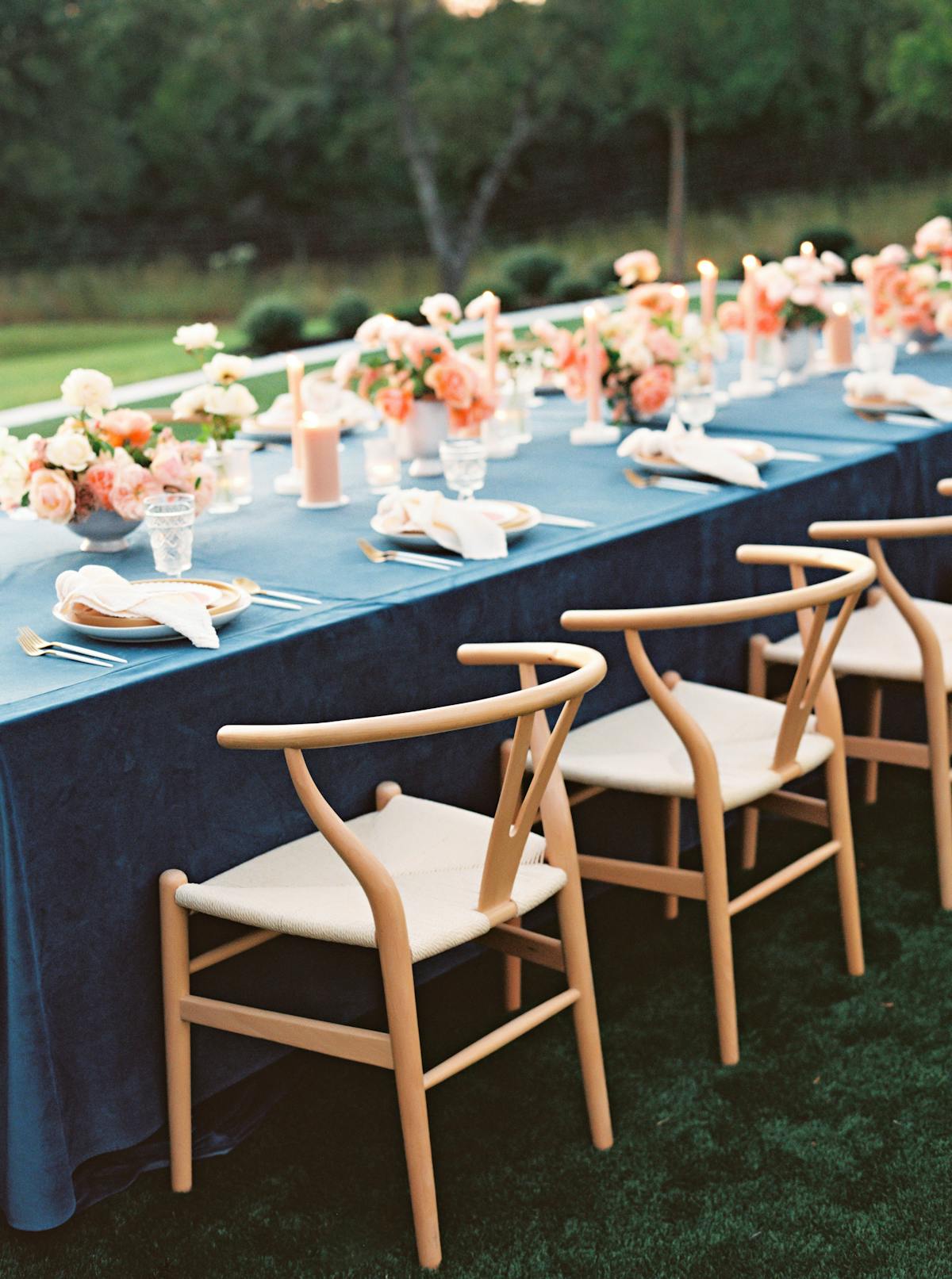 Wedding table design with blue and orange spring color palette