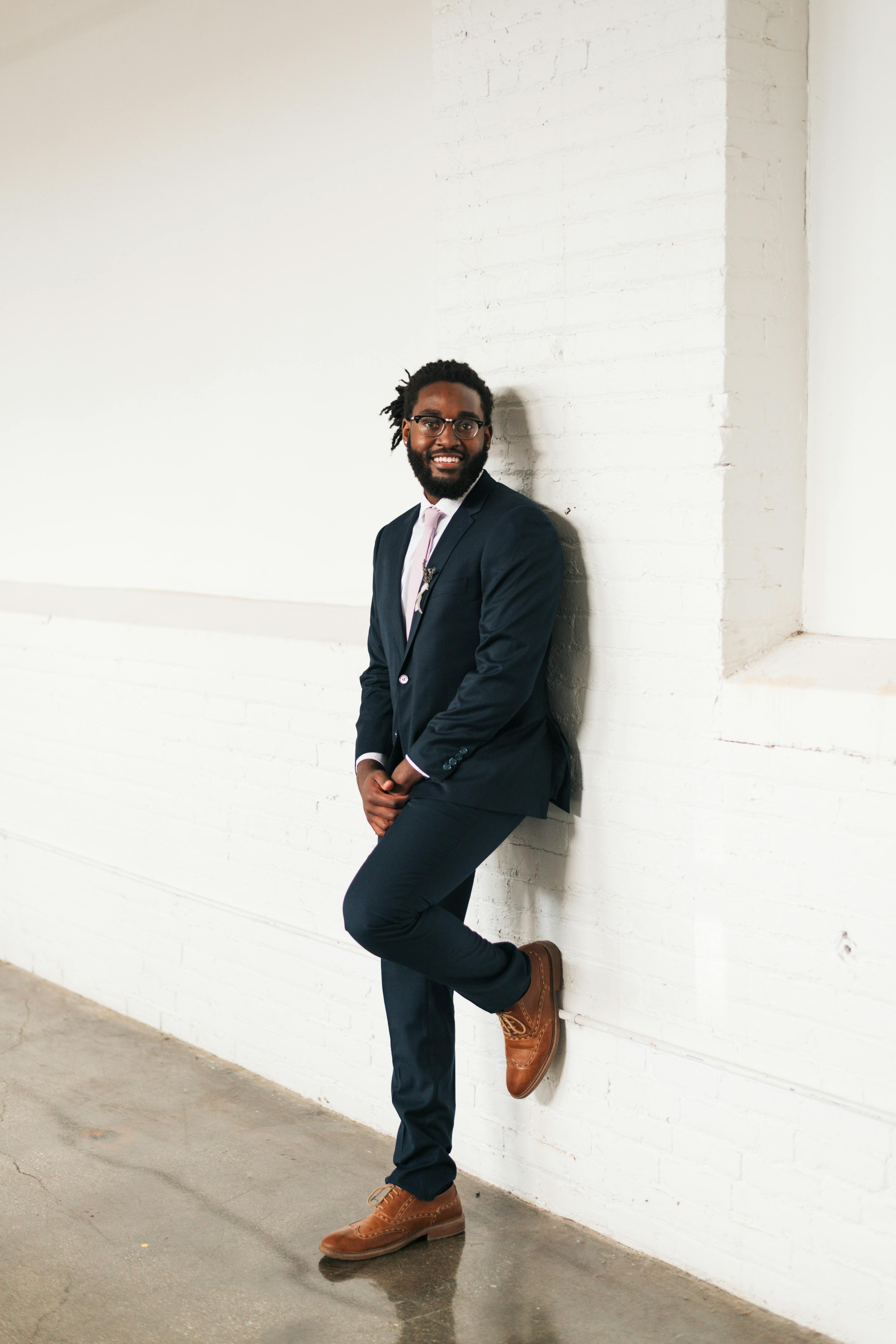 Navy suit with light brown shoes for a groomsman outfit
