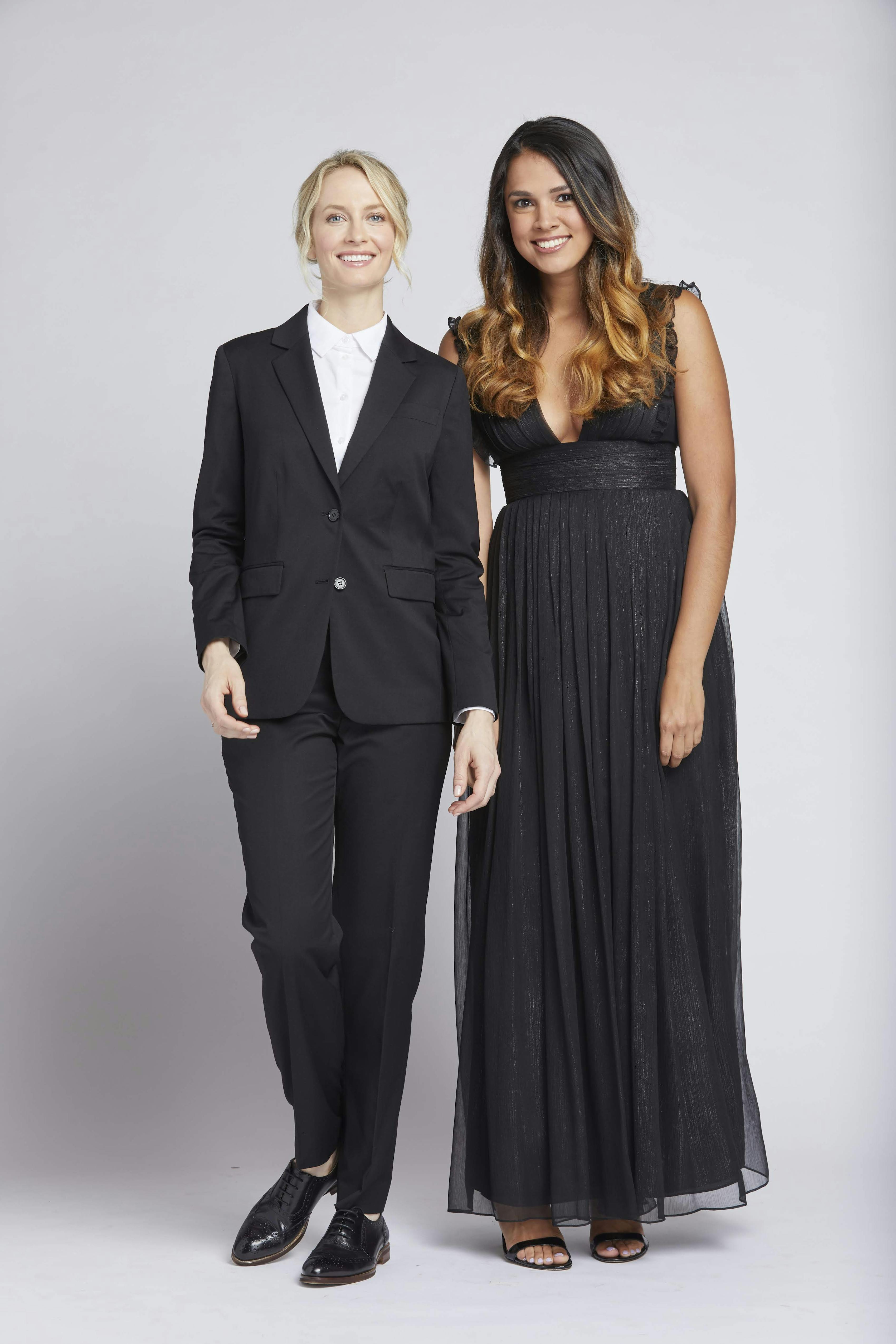 Women's cocktail attire outfits with black suit for women and masculine styling and v-neck black evening dress
