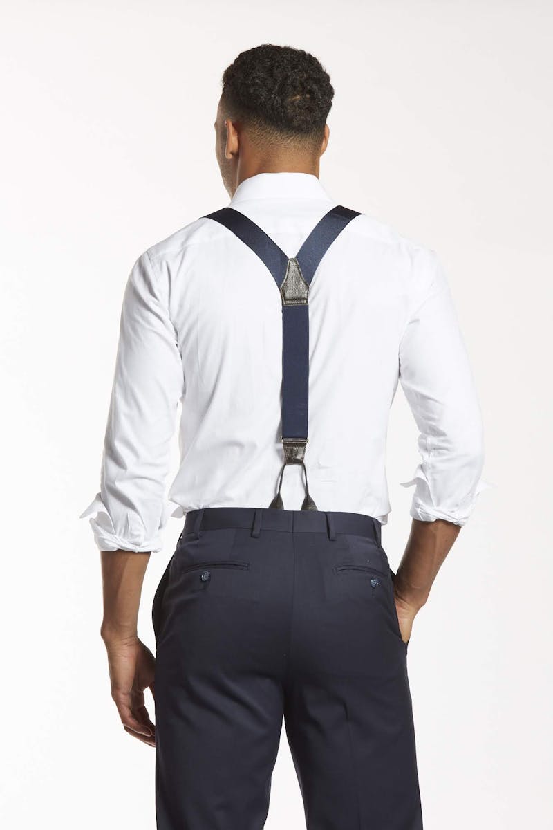 Back of man wearing charcoal grey dress pants styled with suspenders