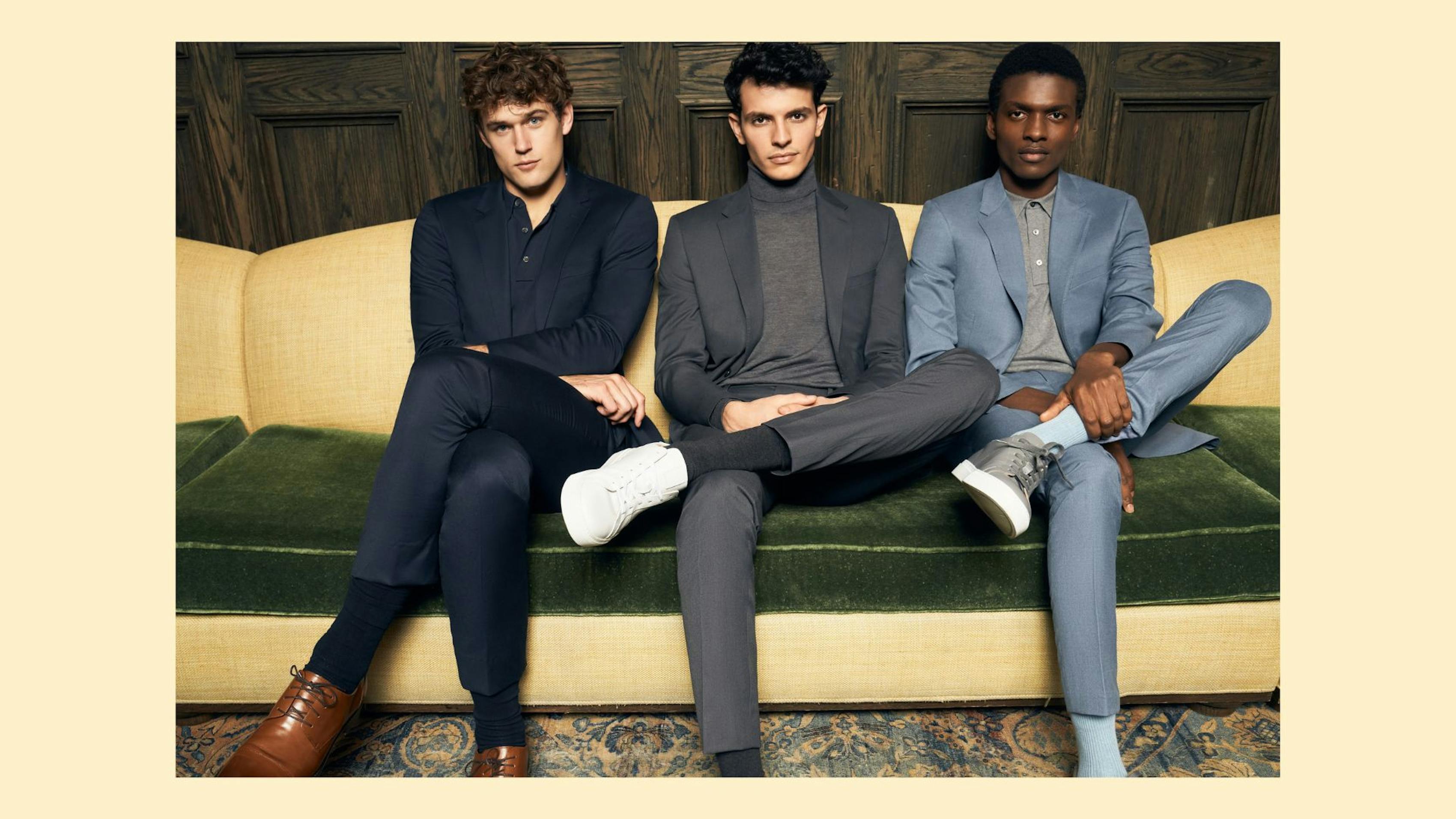 3 men on a couch wearing casual suit pants styed as slacks and dress pants.
