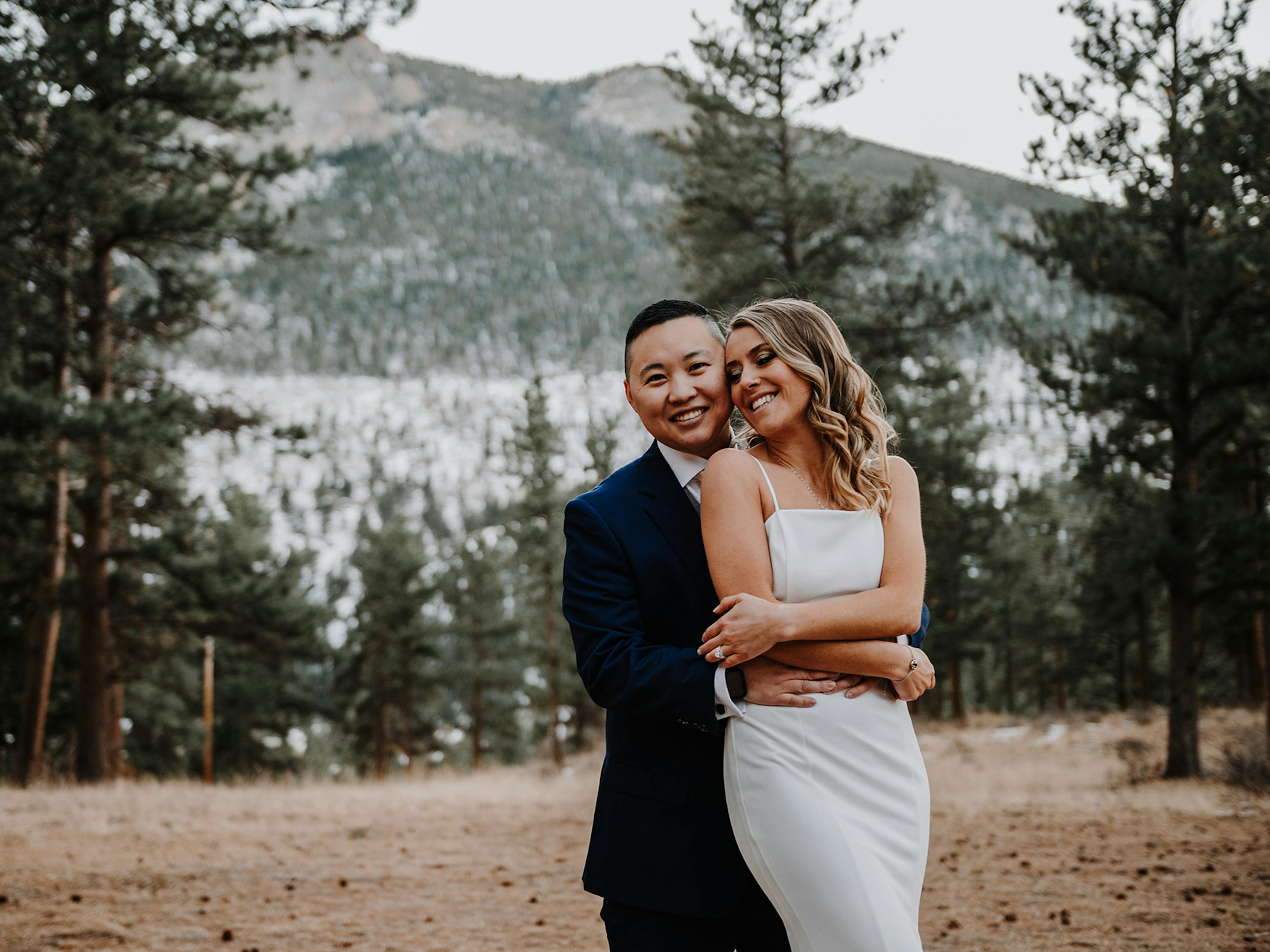 brides pose in rocky mountains for wedding photos