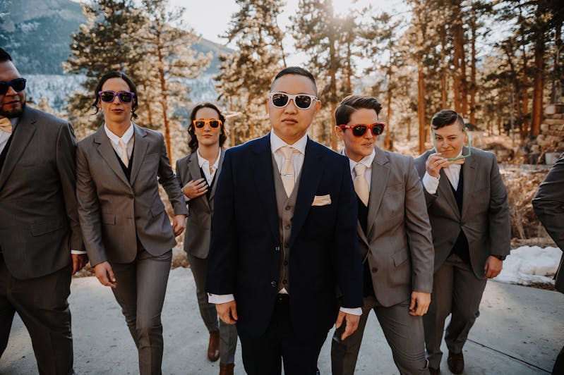 wedding party suits in navy and light gray with vests