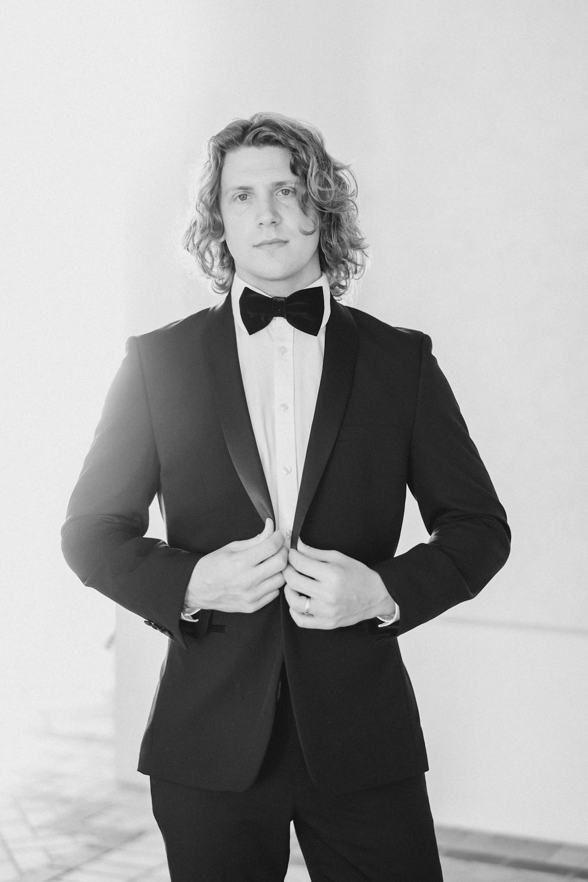 Men's tuxedo and bow tie for black-tie event in black and white