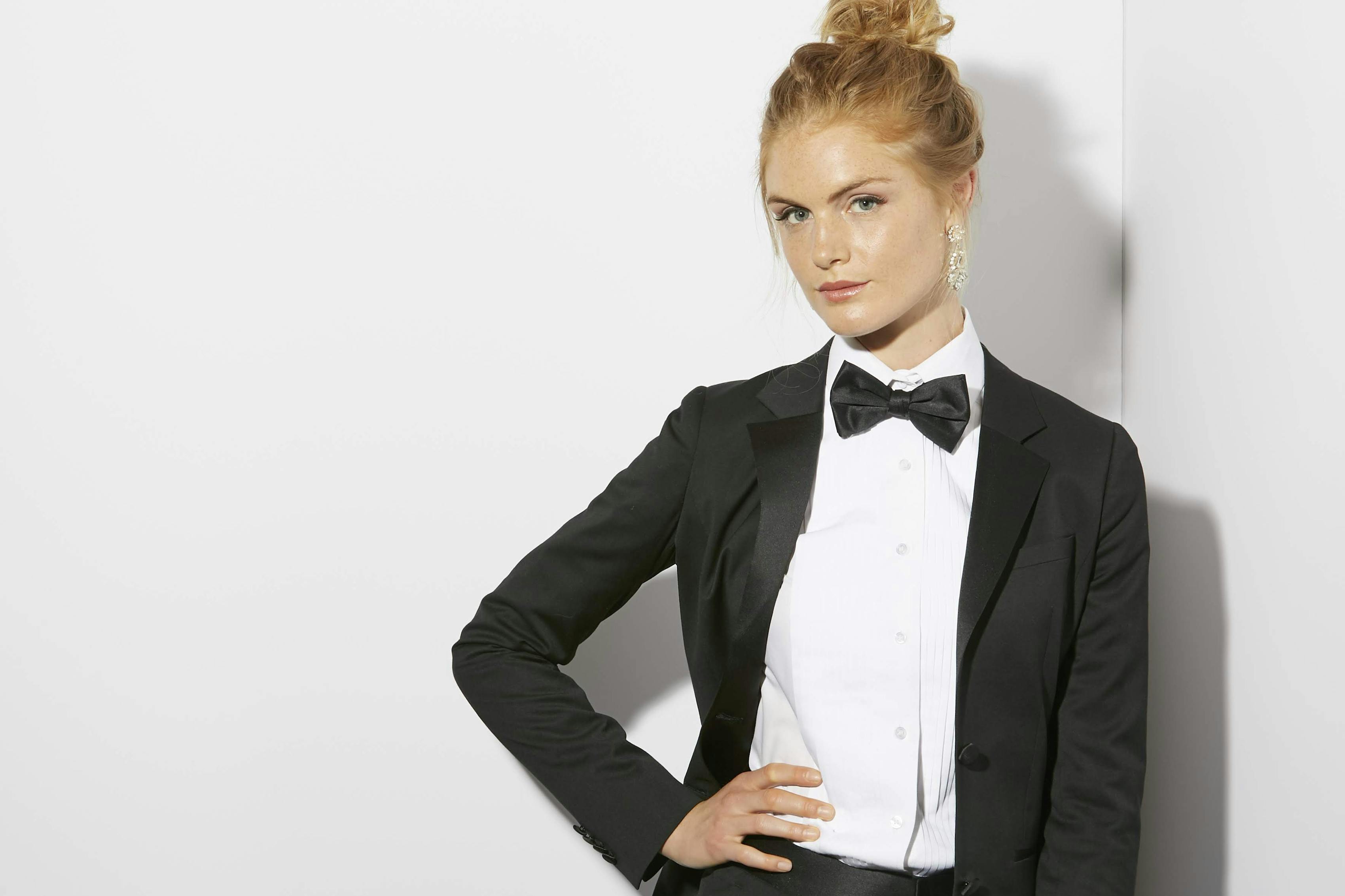 Women's bow tie style wearing a black tuxedo for women