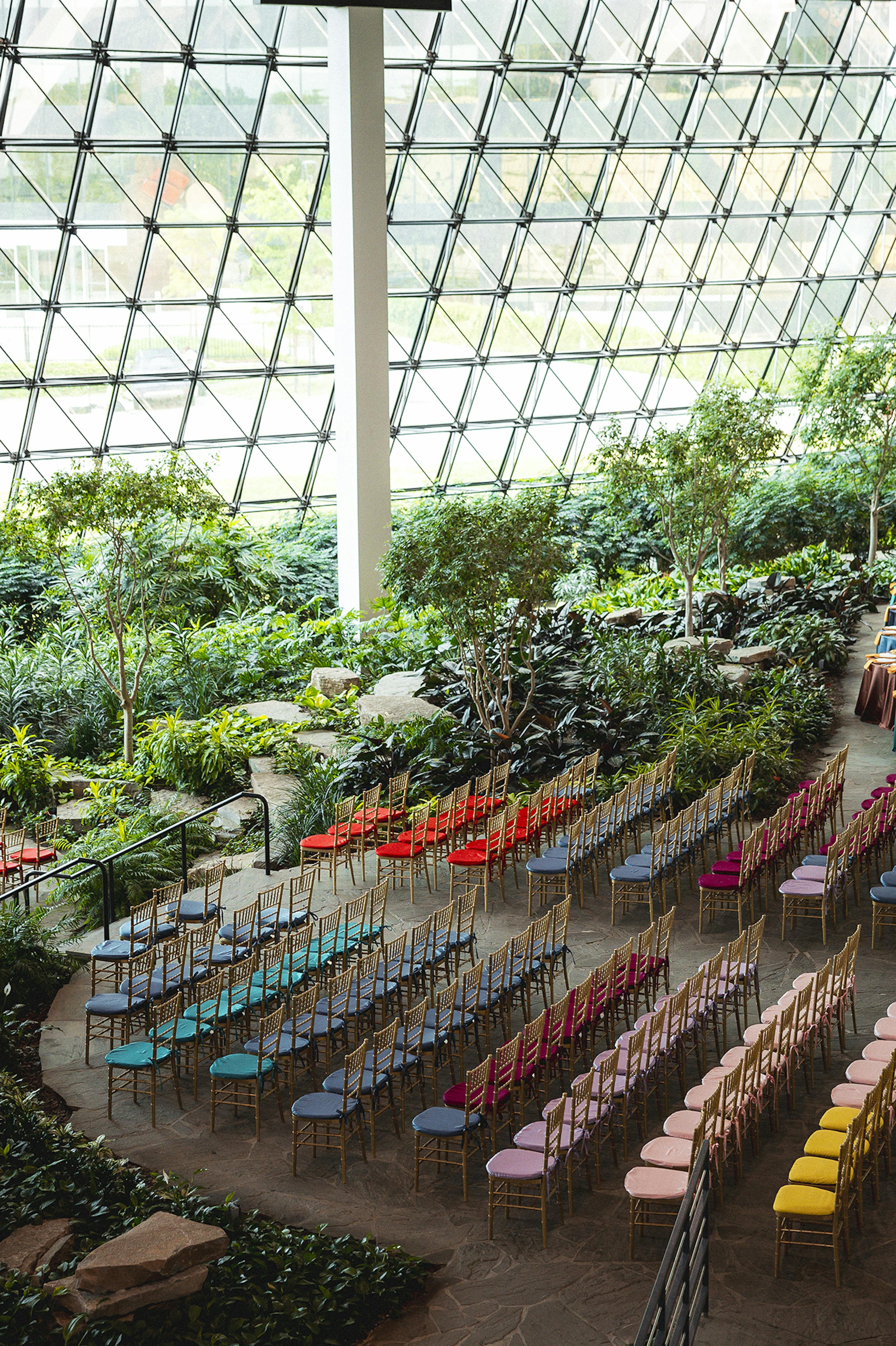 Creative ceremony seating, featuring colorful upholstered Chivari chair cushions 