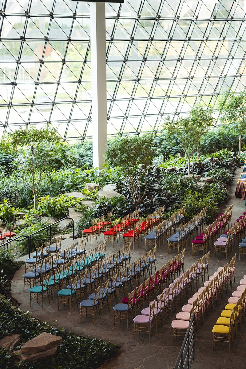 Creative ceremony seating, featuring colorful upholstered Chivari chair cushions 