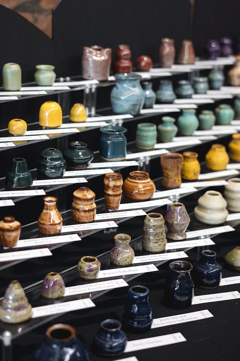 A creative and thoughtful seating chart, displaying 180 handcrafted ceramic pots as wedding favors