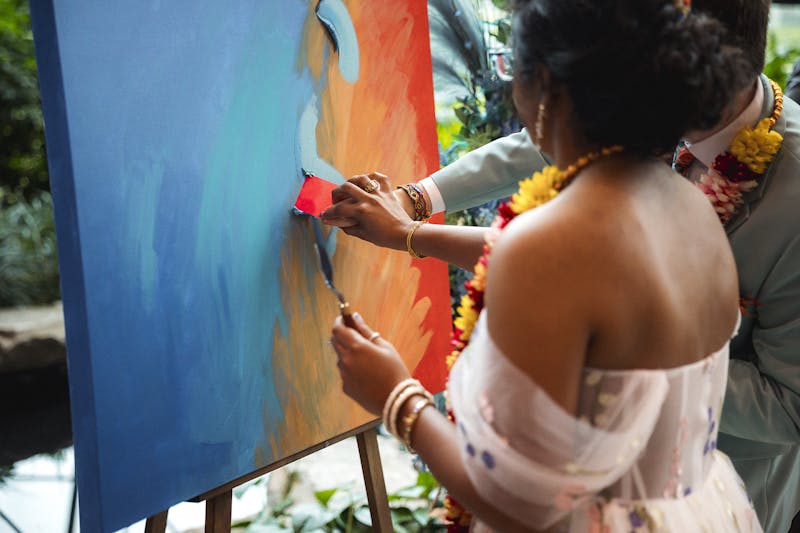 A twist on the traditional first dance, this is a first craft—a communally created art piece to serve as a wedding day memento 