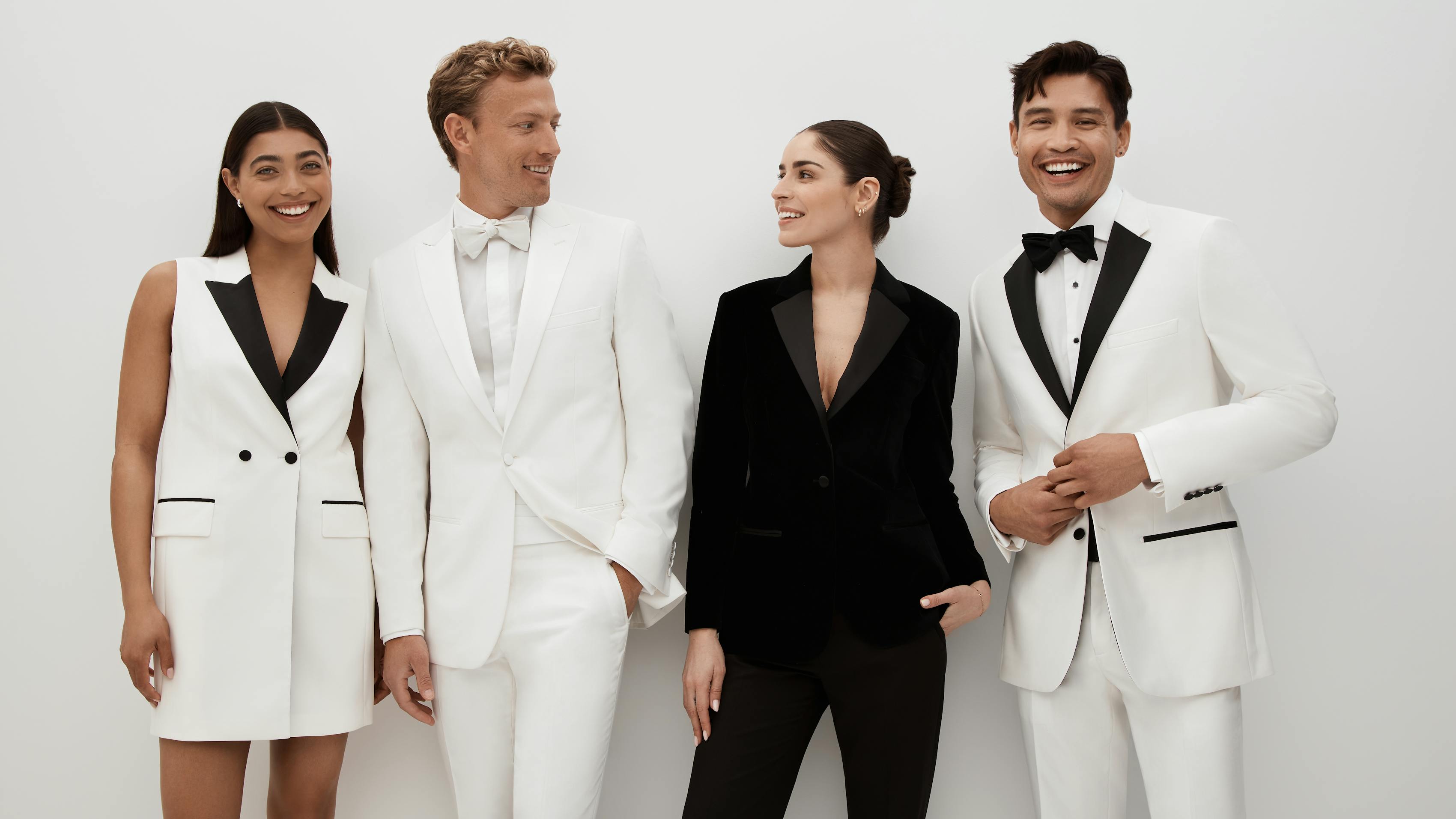 Black tie event outfits in white tuxedo dress, black & white men's tuxedos, and women's velvet tuxedo