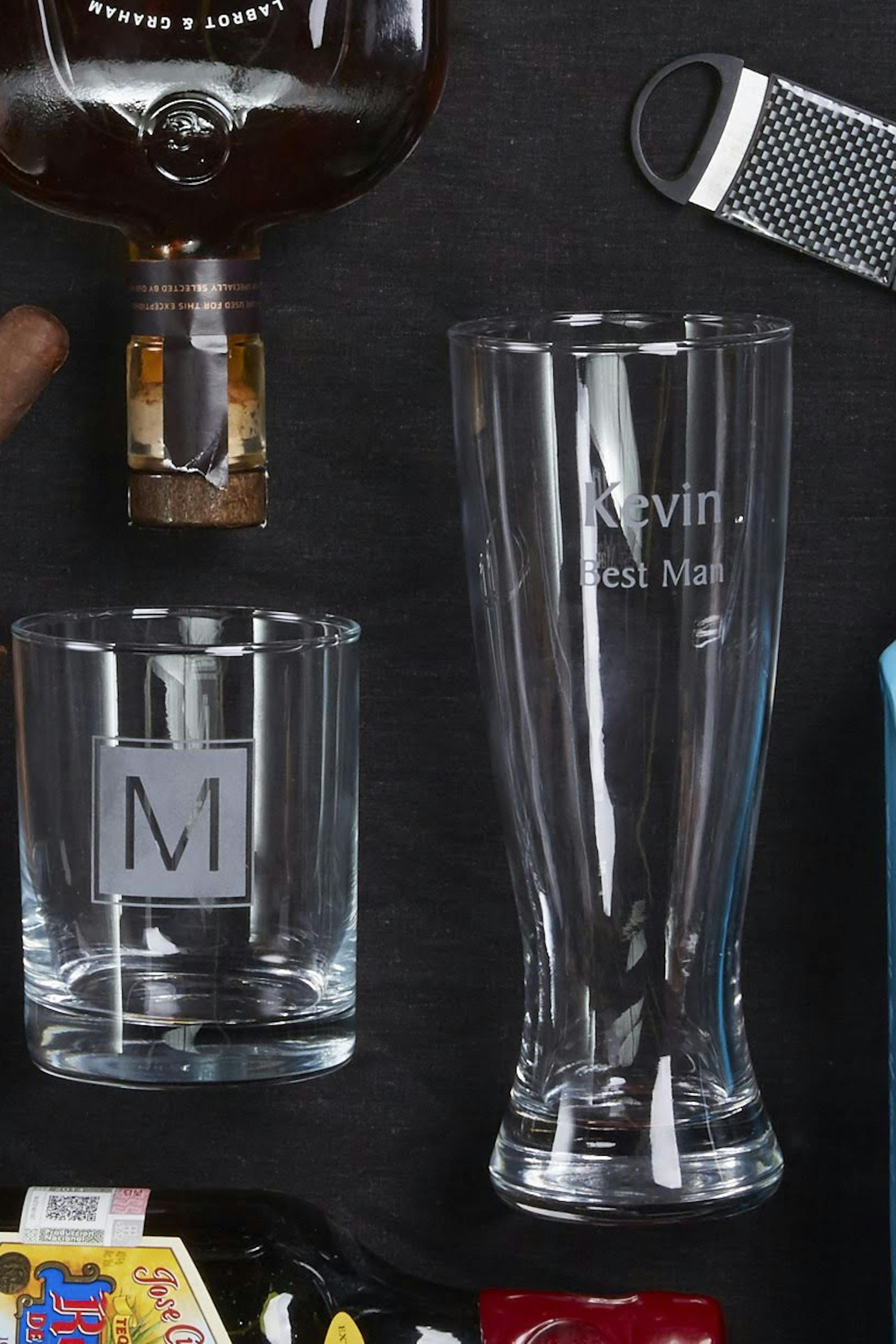 Monogrammed whiskey glass, cigars, gin, and more for groomsman gift package
