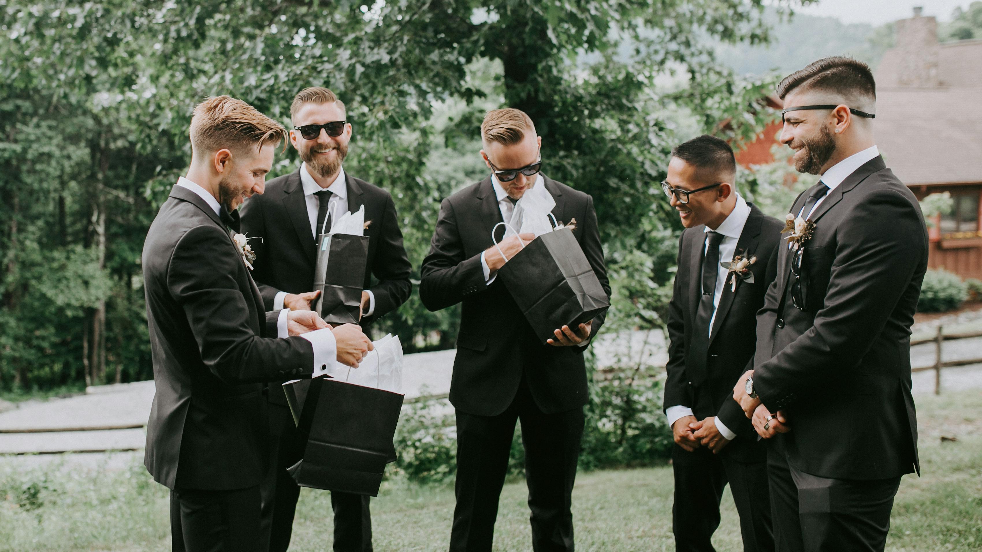 Groom giving his groomsman gifts on the wedding day