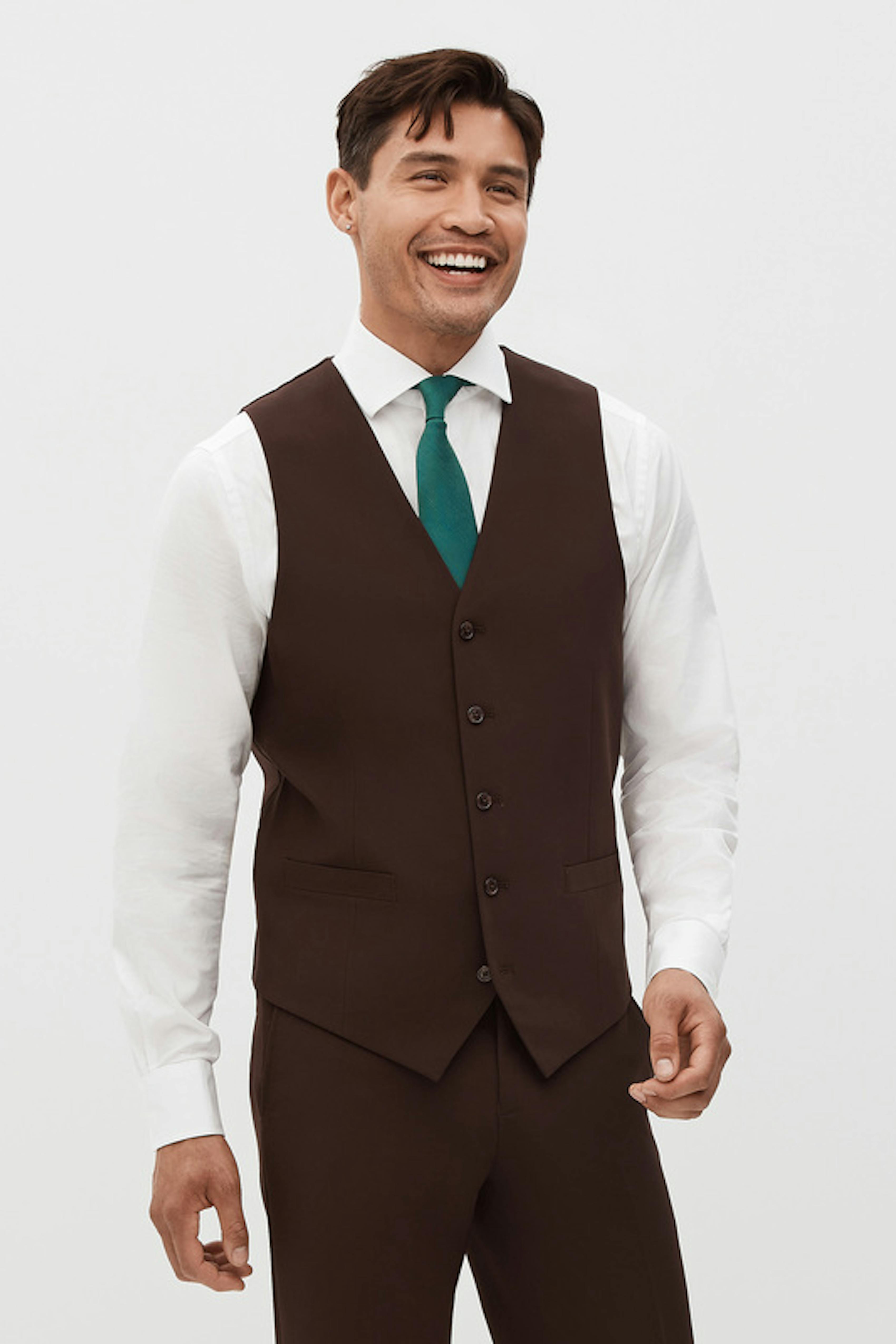 Men's dark brown suit with vest for an earthy wedding theme