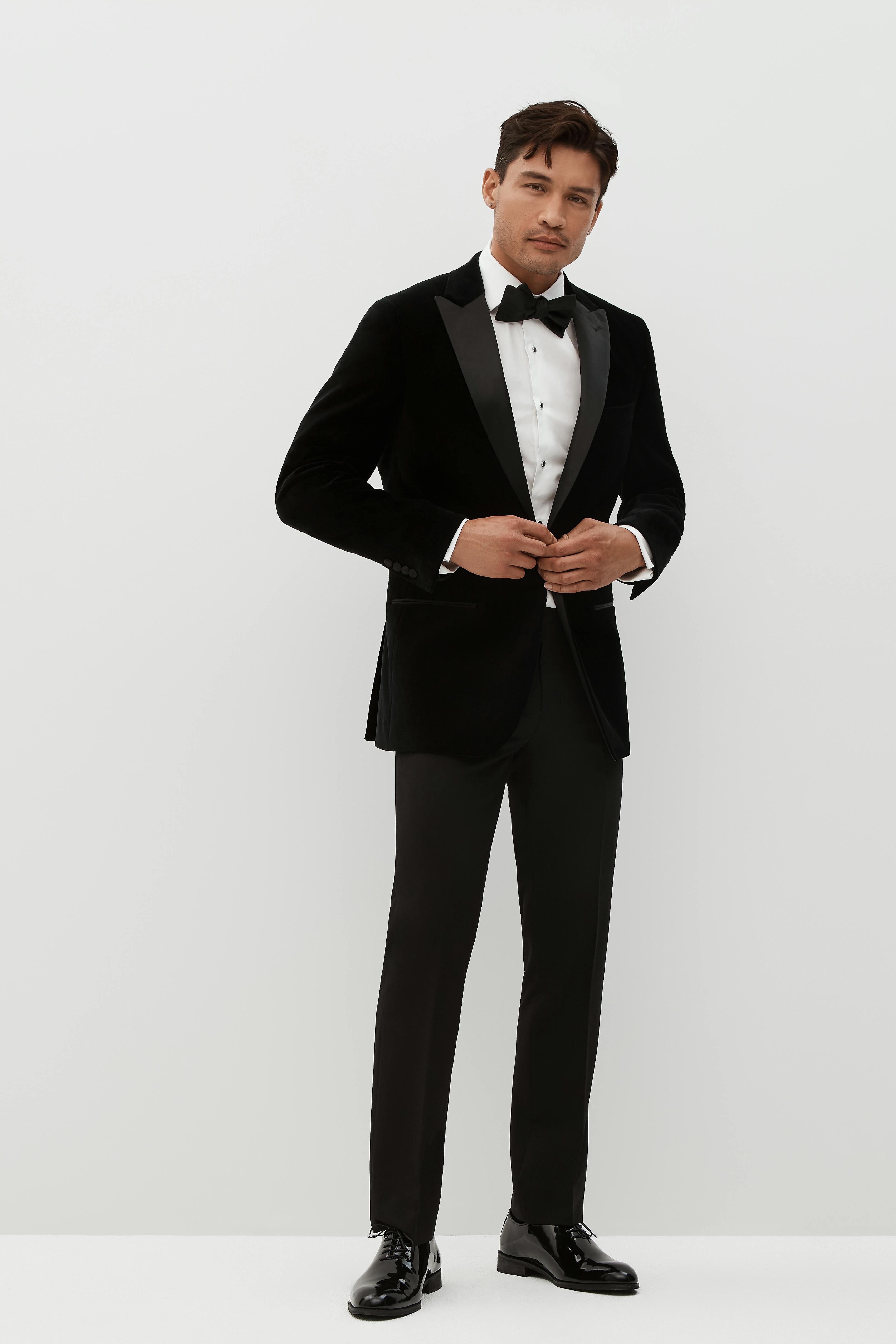 Holiday party guest wearing a velvet tuxedo for men