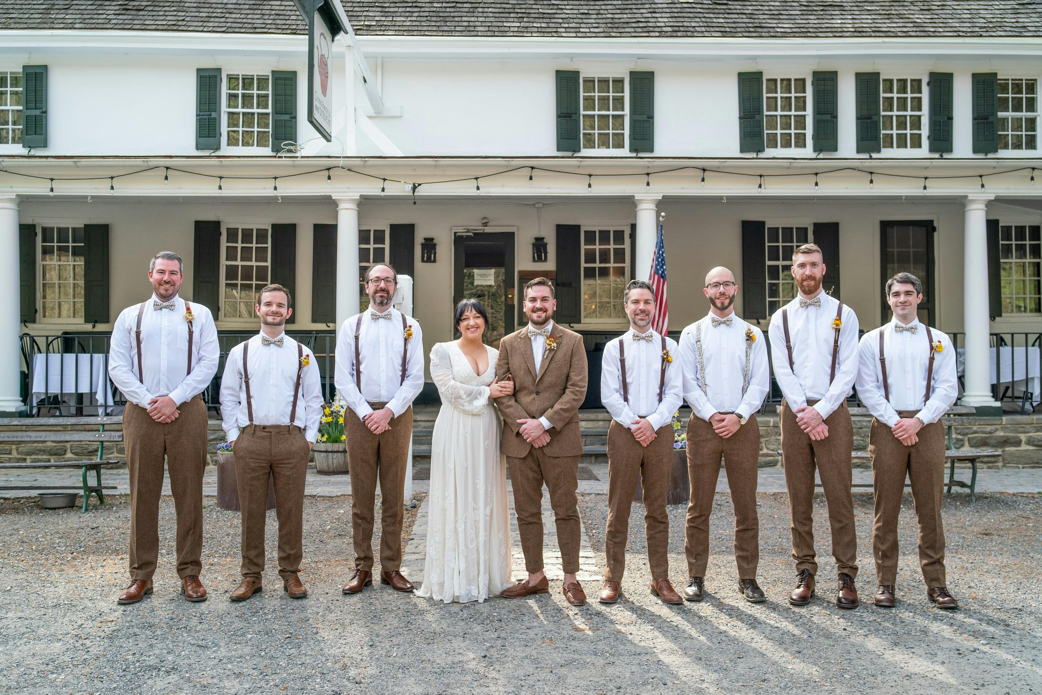 Tweed suit wedding with groomsmen and bride posing with groom