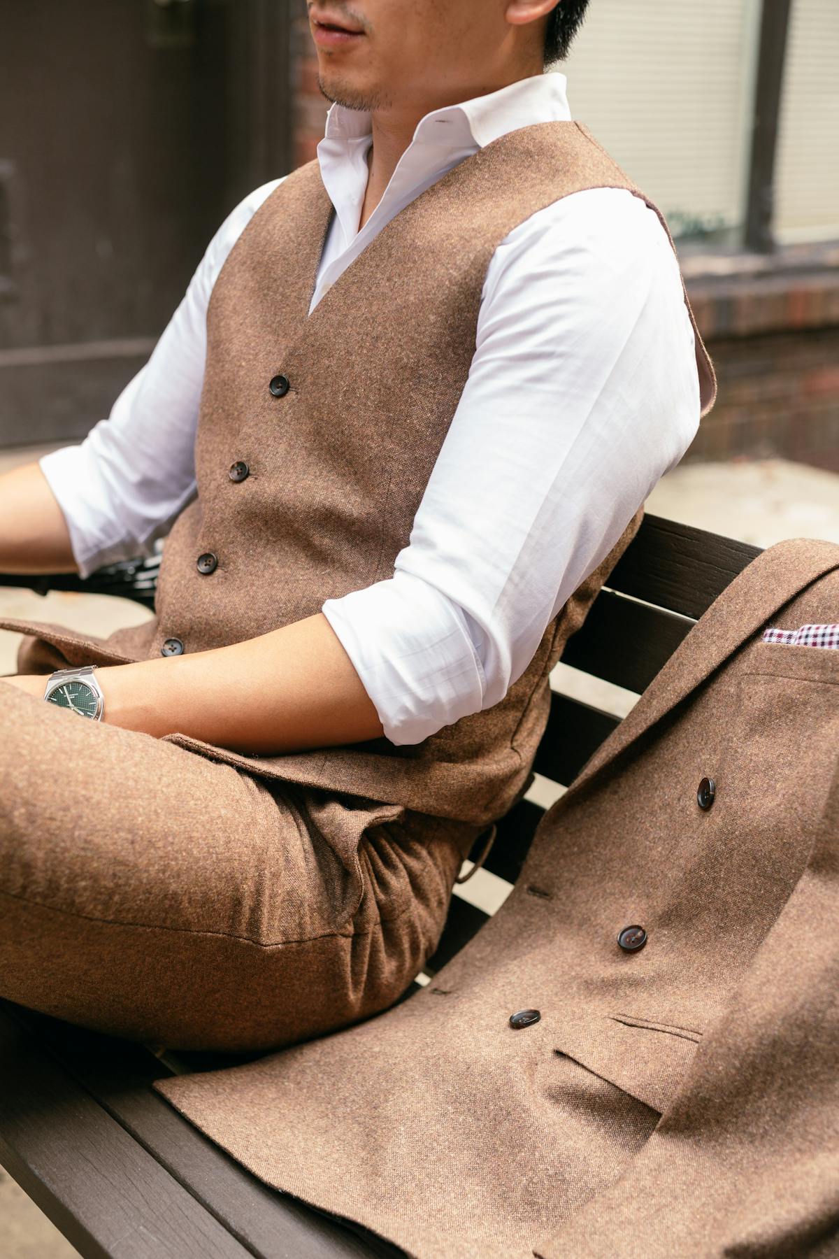 Up close tweed details featuring a Doubled Breasted Tweed Suit Jacket, Vest, and Pants