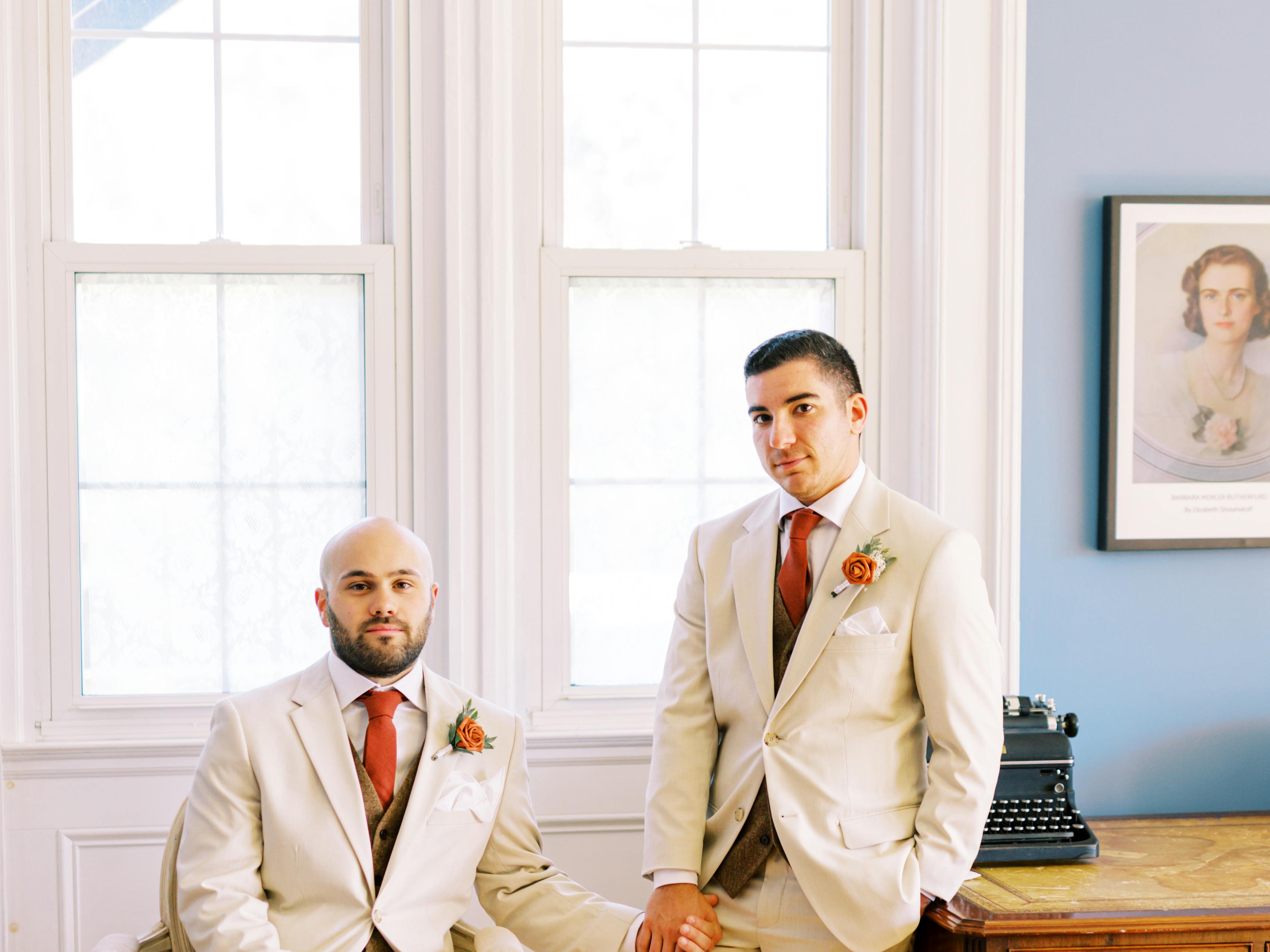 Gay wedding with two grooms in tan wedding suit and tweed suit vests