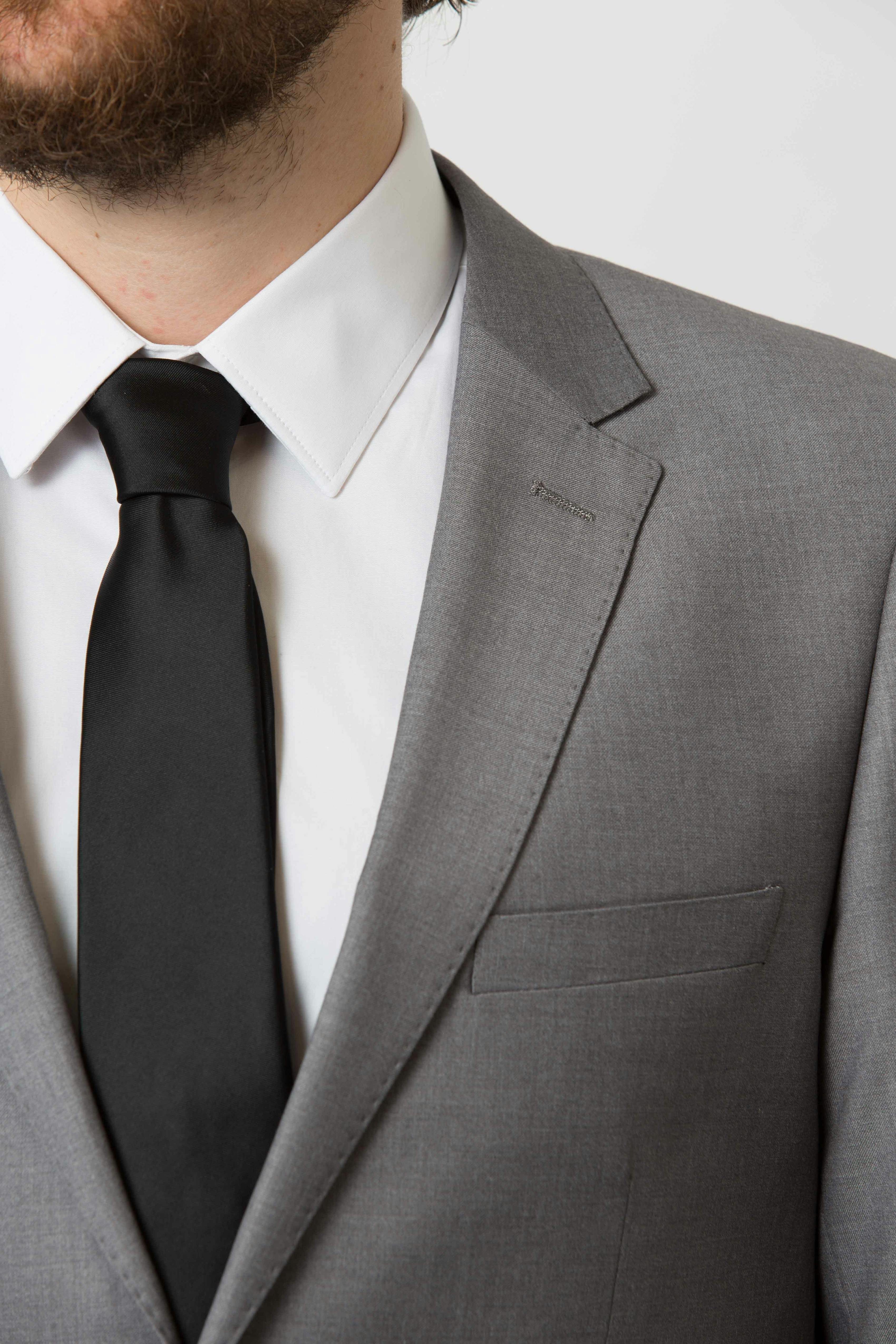 Men's grey suit jacket with a notch lapel and black tie