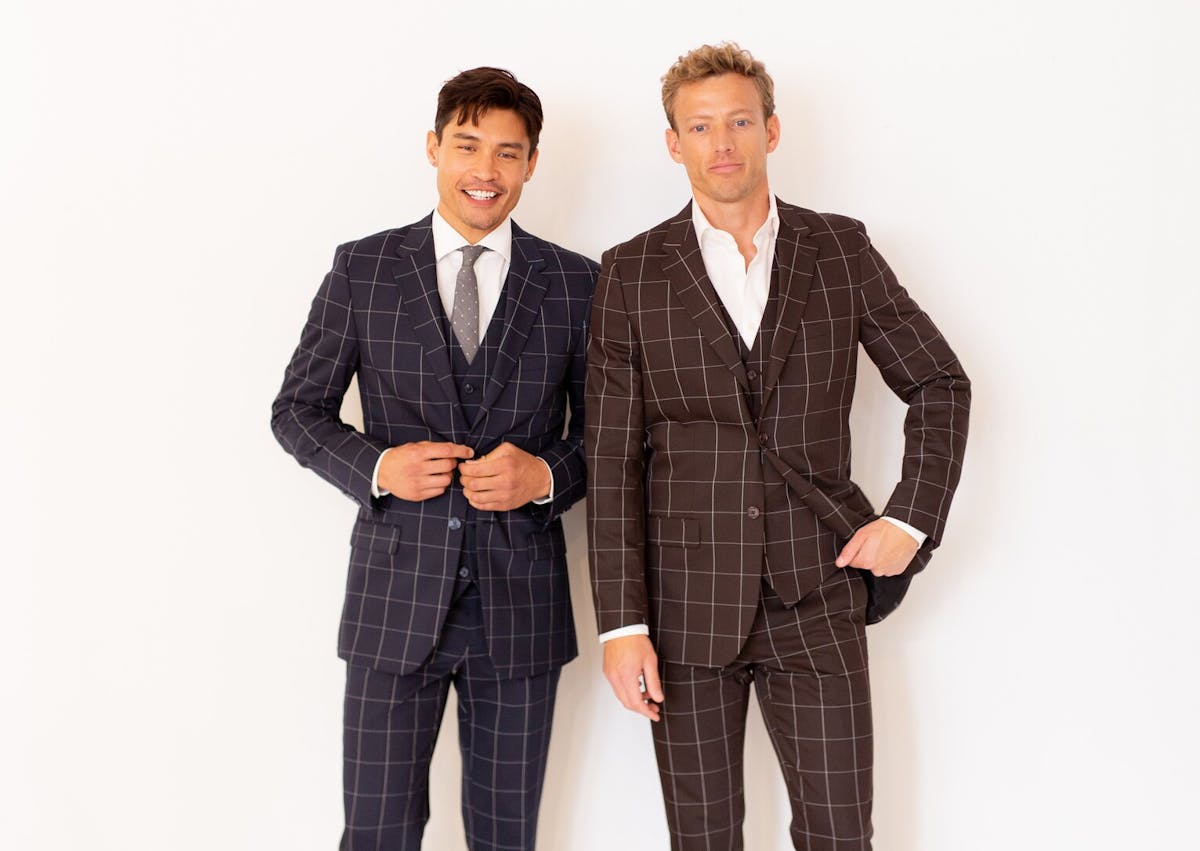 Men's patterned suits in navy blue and dark brown for unique formal style.