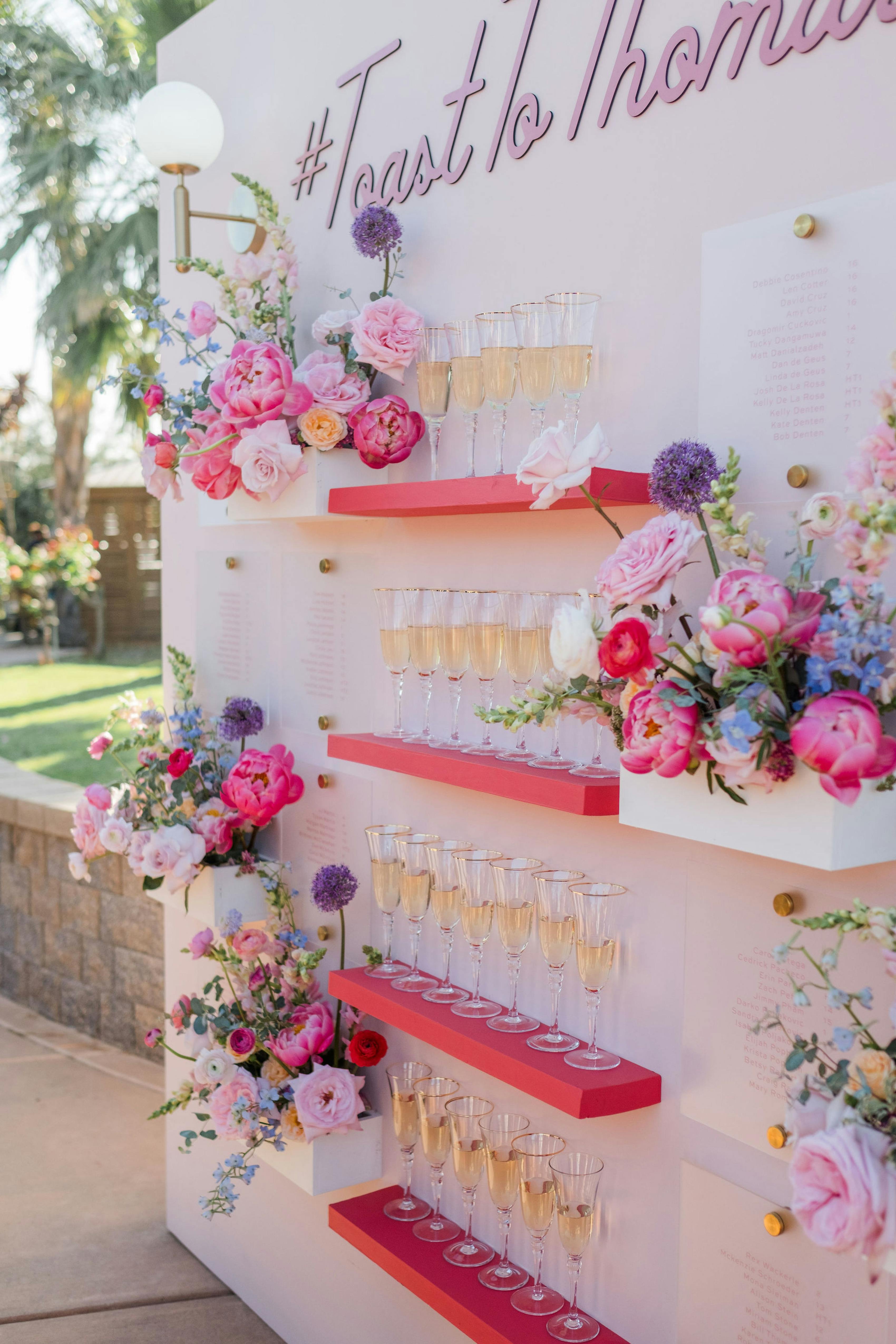 Champagne for each guests while they find their seating assignment on the grand pink seating chart.