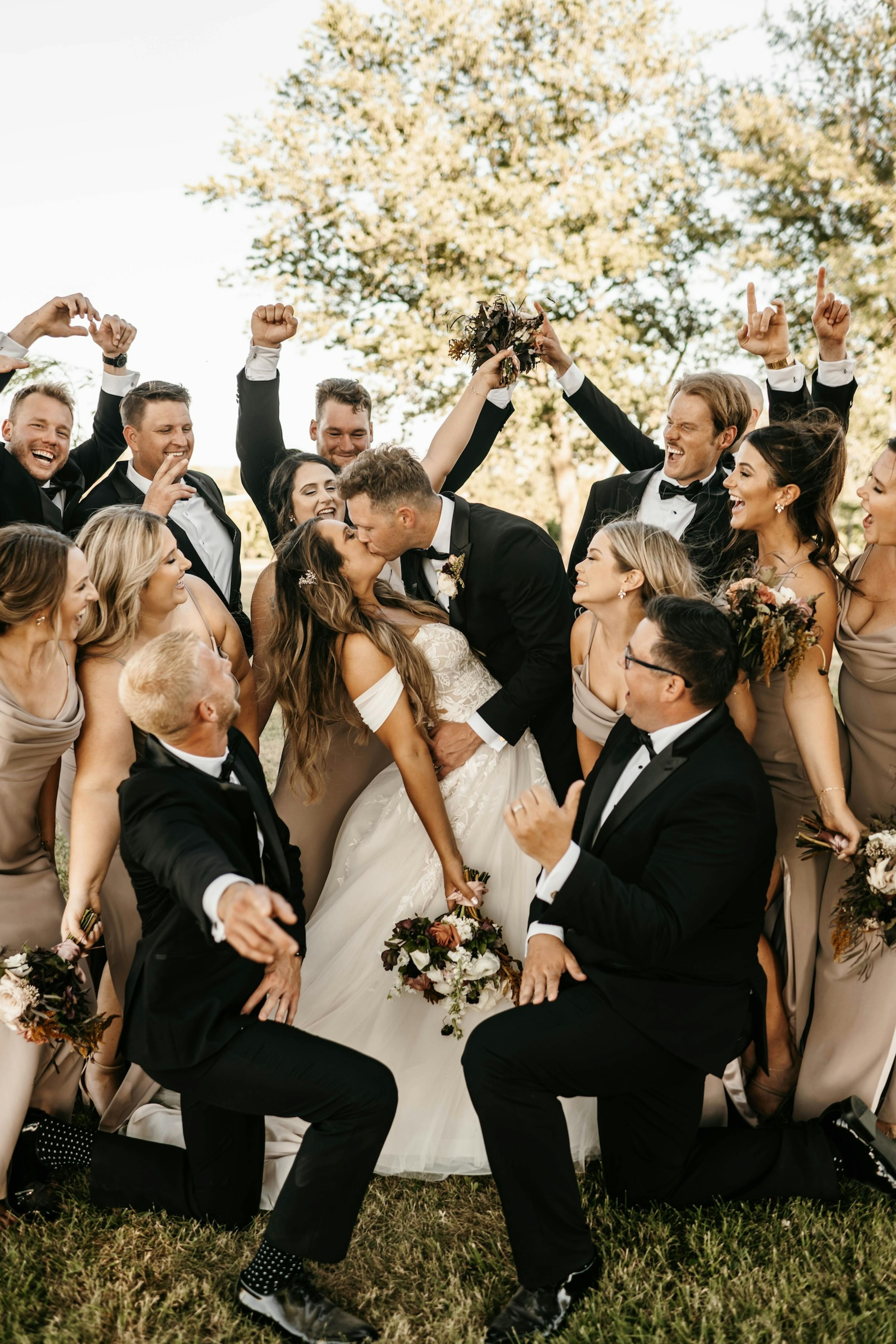 group of wedding party members in black tie attire