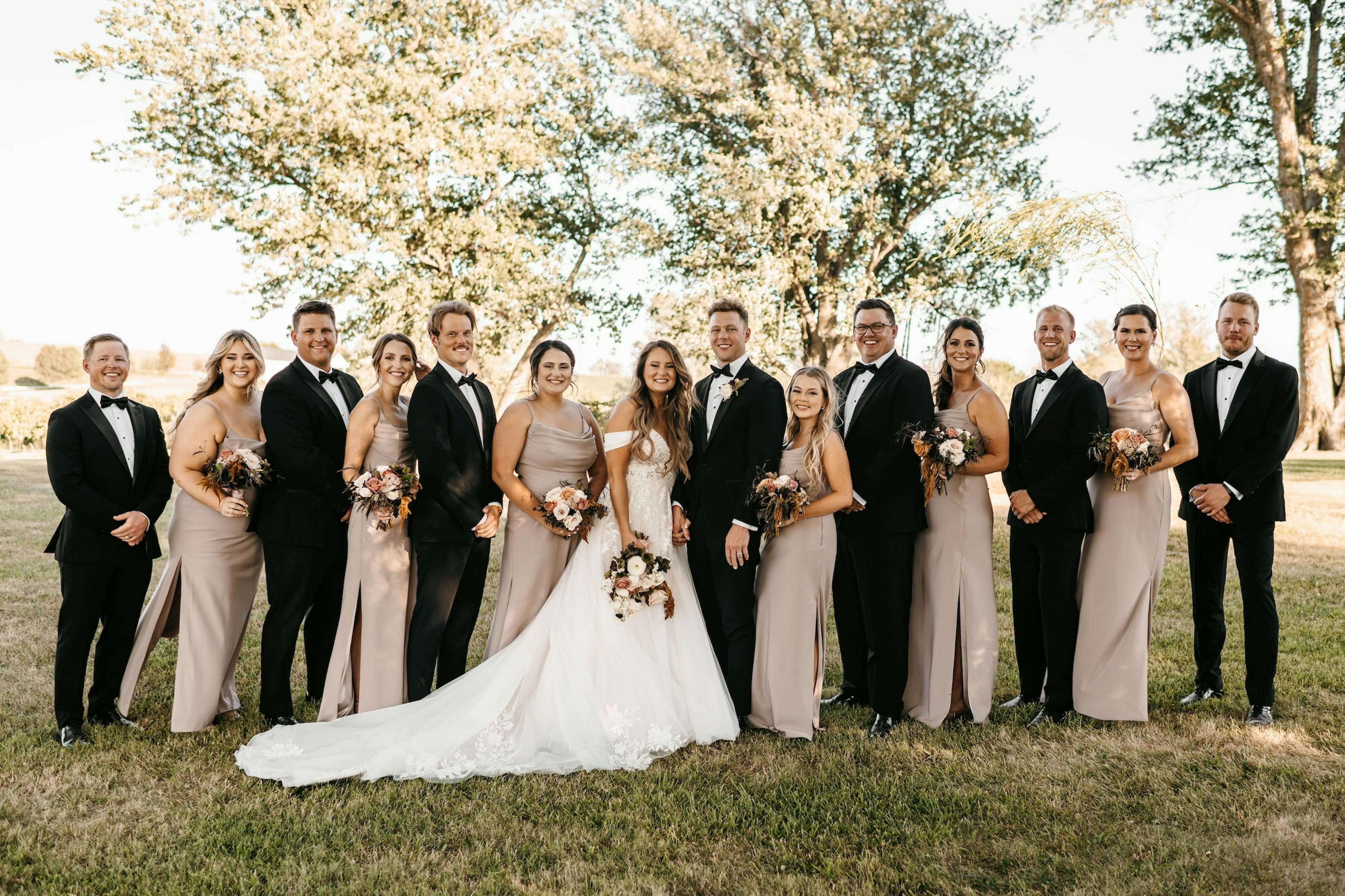 elegant and neutral wedding party attire black and taupe color palette