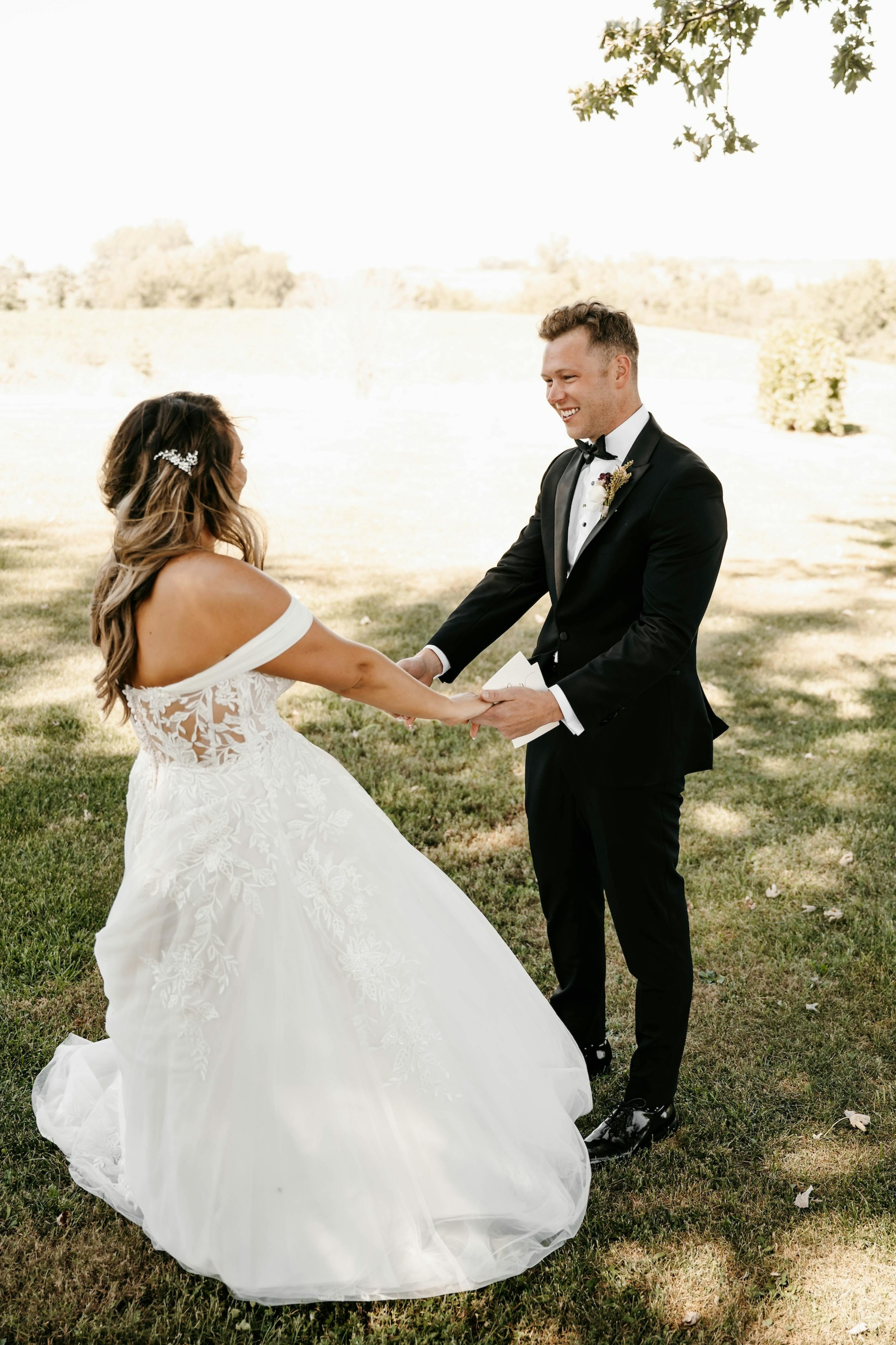 bride and groom's first look in a vineyard