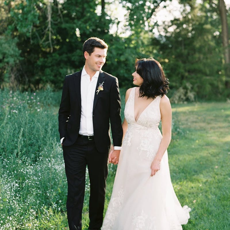 black suit casual backyard wedding
