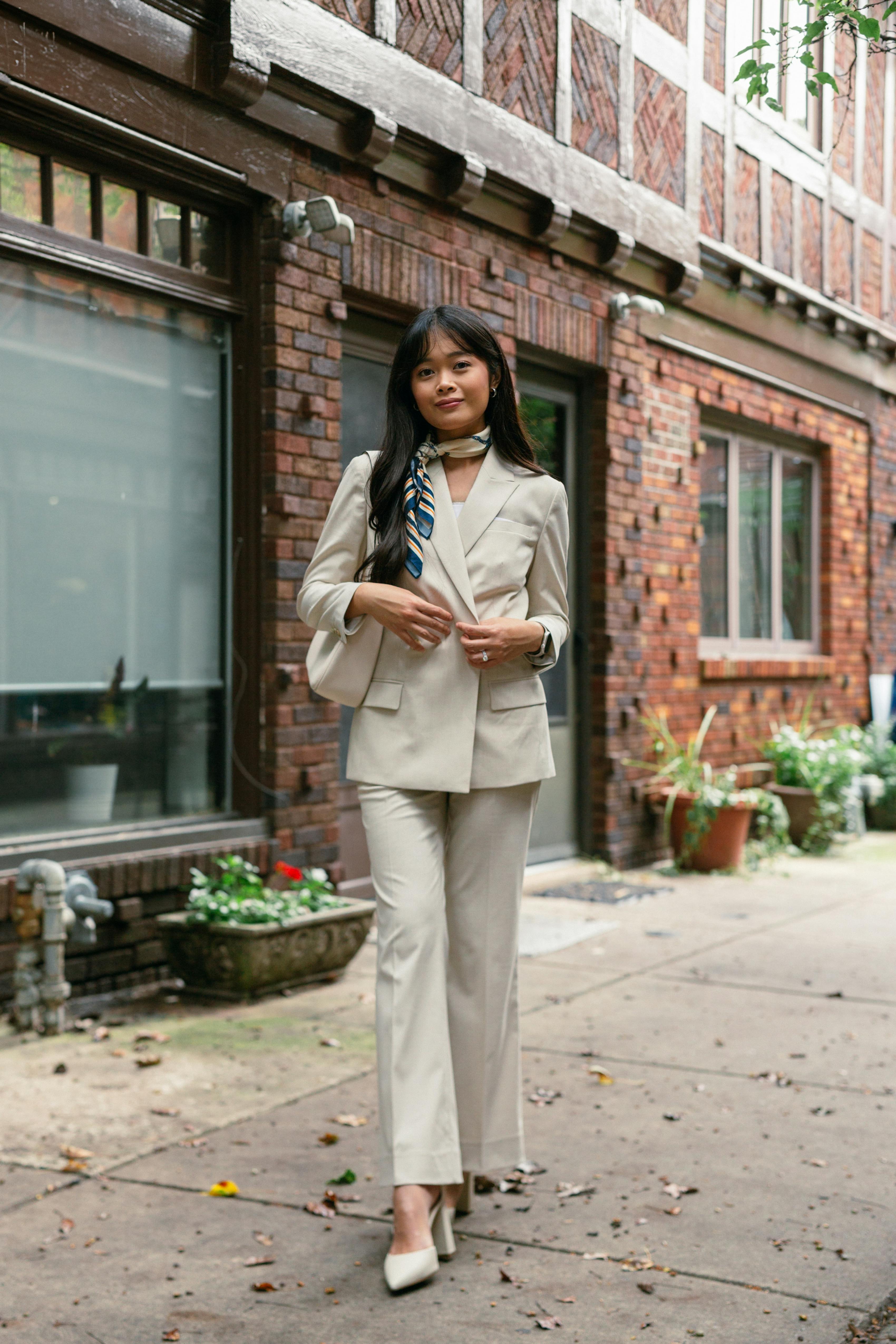 Women's graduation suit outfit in tan color with neck scarf for chic school style