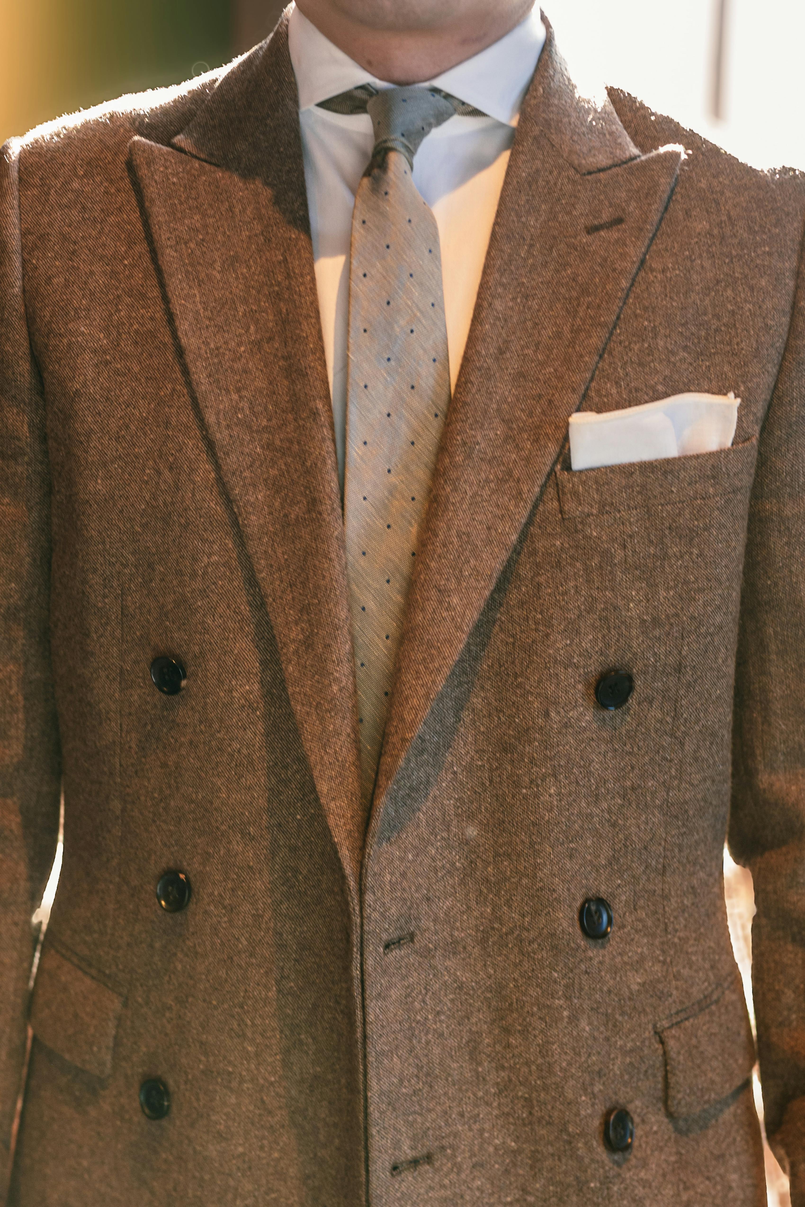 Men's brown tweed double breasted suit styled for groom outfit