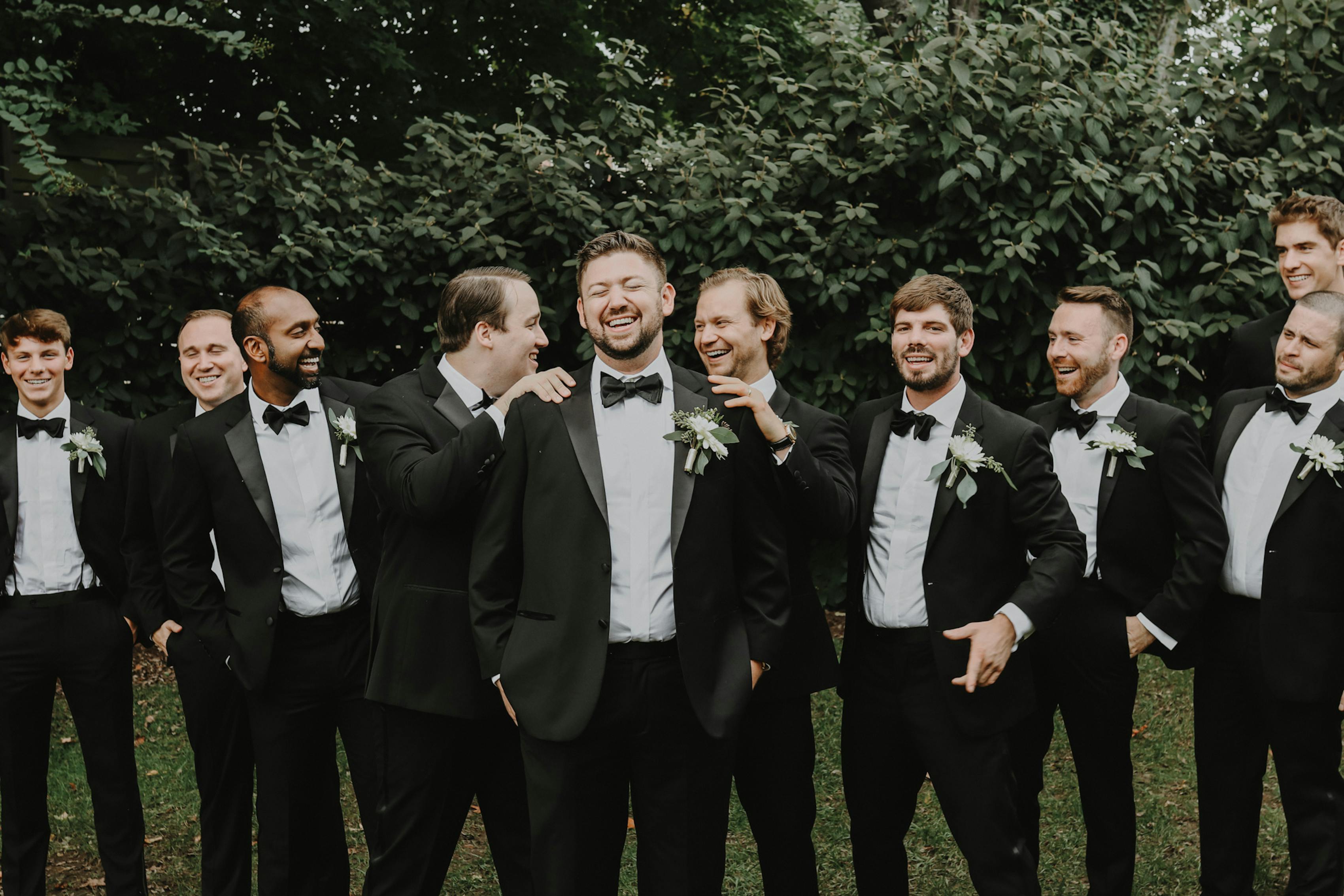 Classic black wedding tuxedos for groomsman portrait