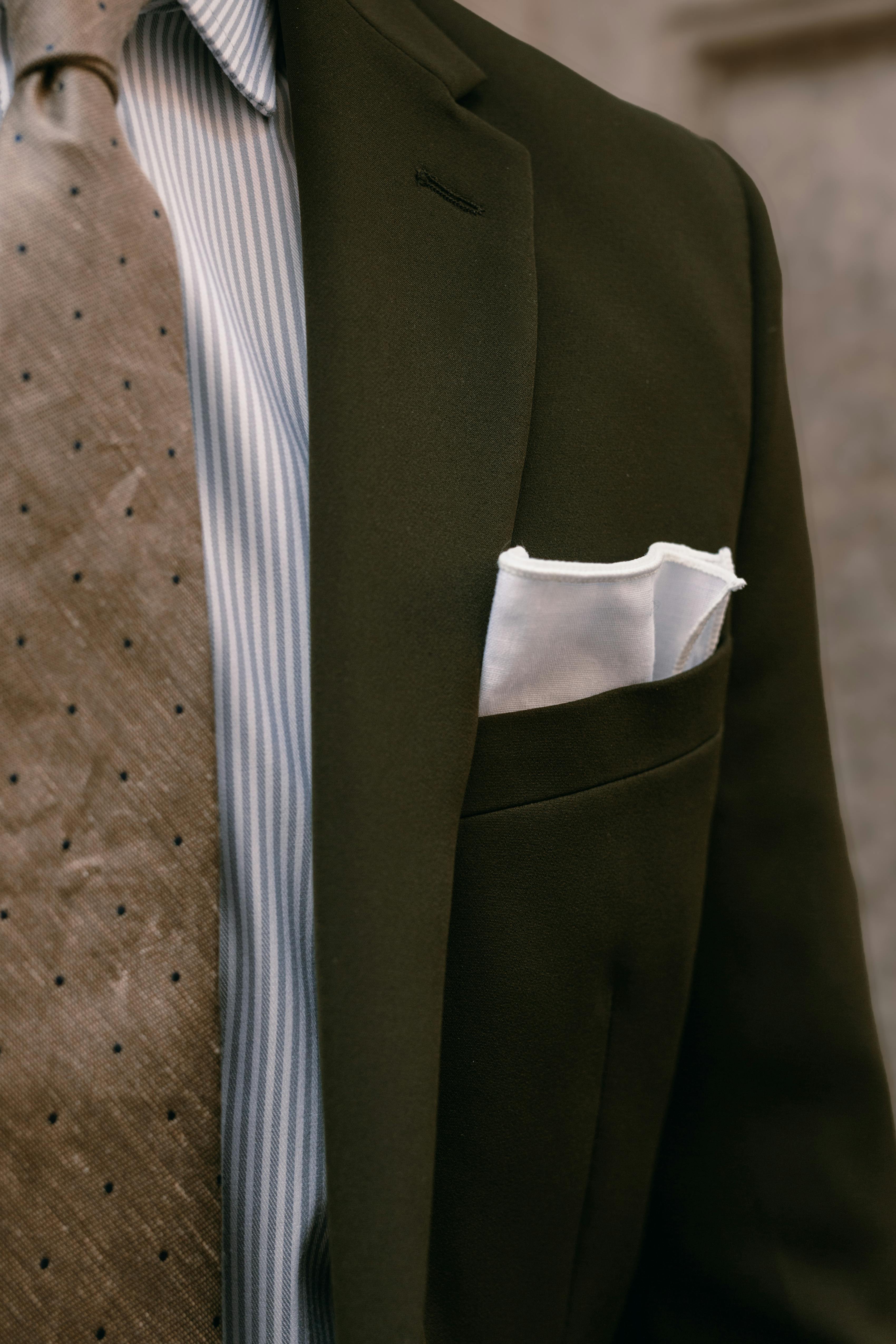 Layering patterns with men's accessories for olive green suit outfit