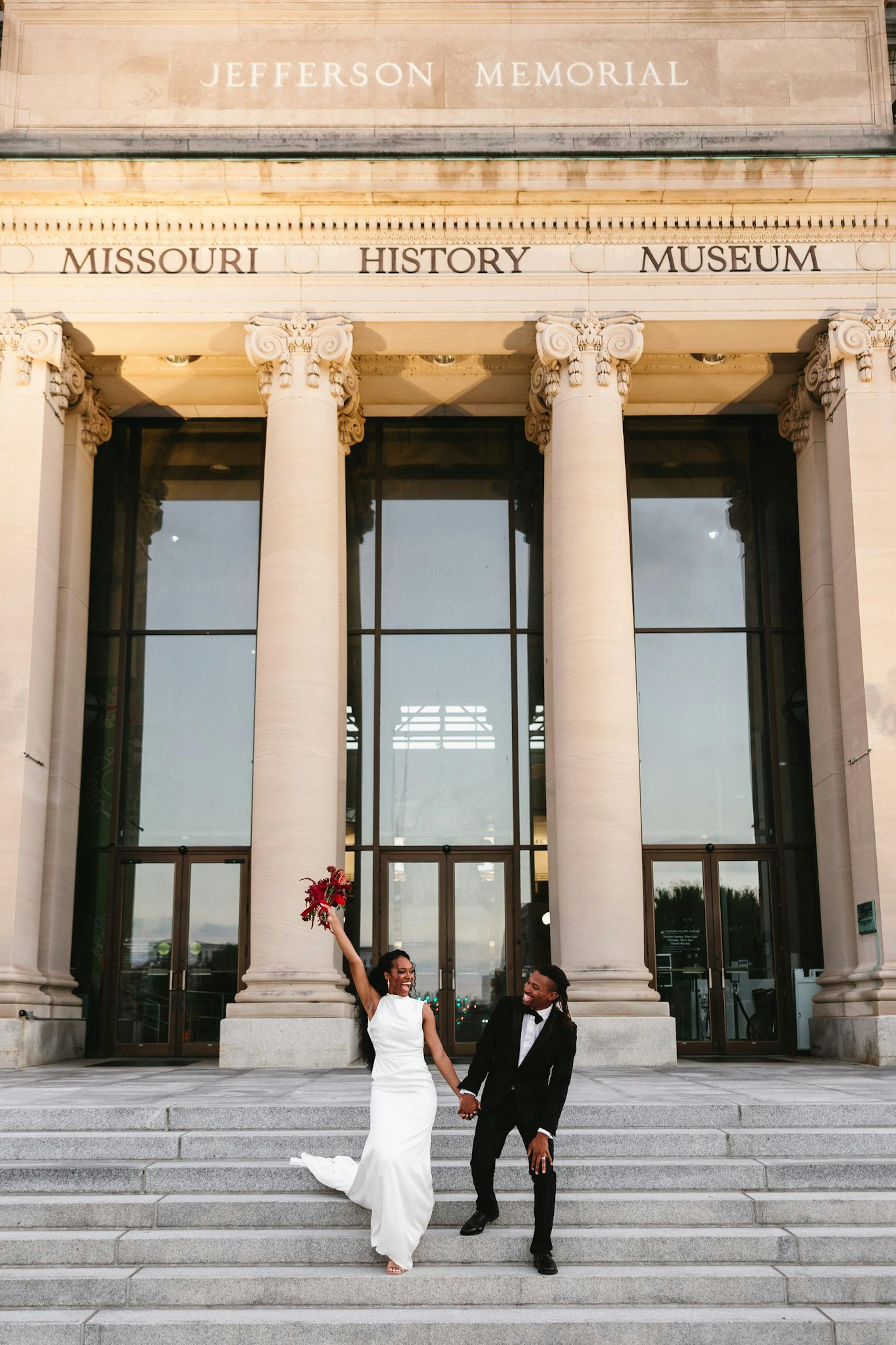 bride and groom black tie wedding exit