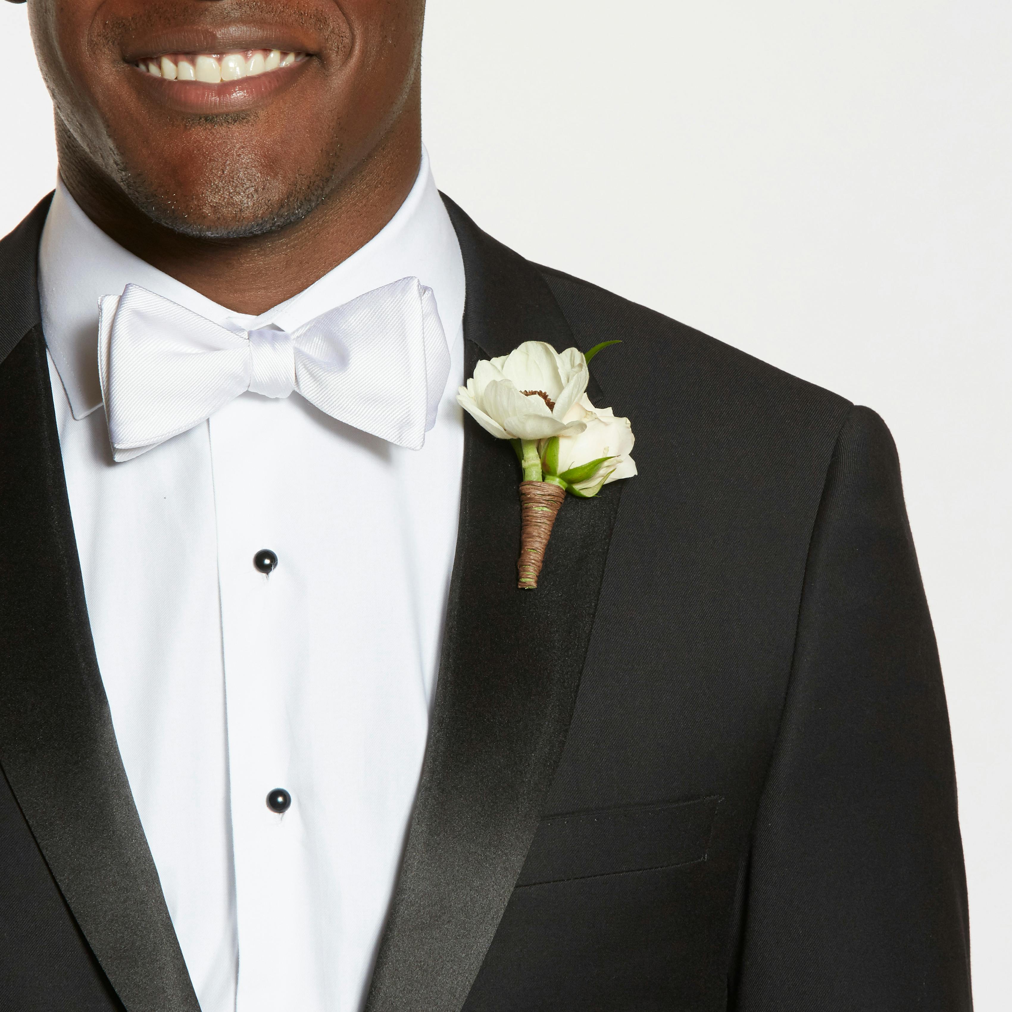 Black tuxedo with white bow tie and shawl lapel for groom or groomsman